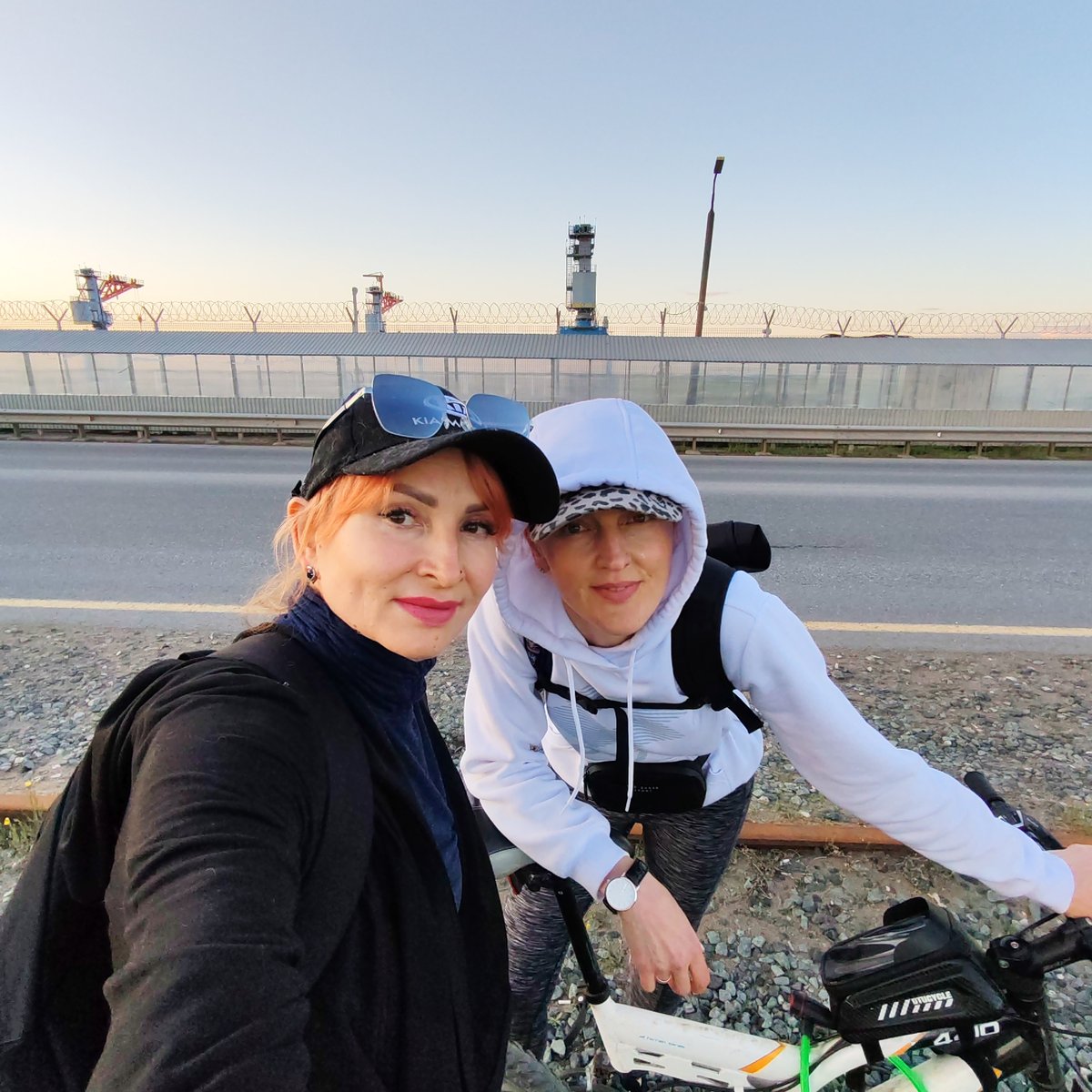 Two women document sunset cycling trip in Chaikovsky, Russia