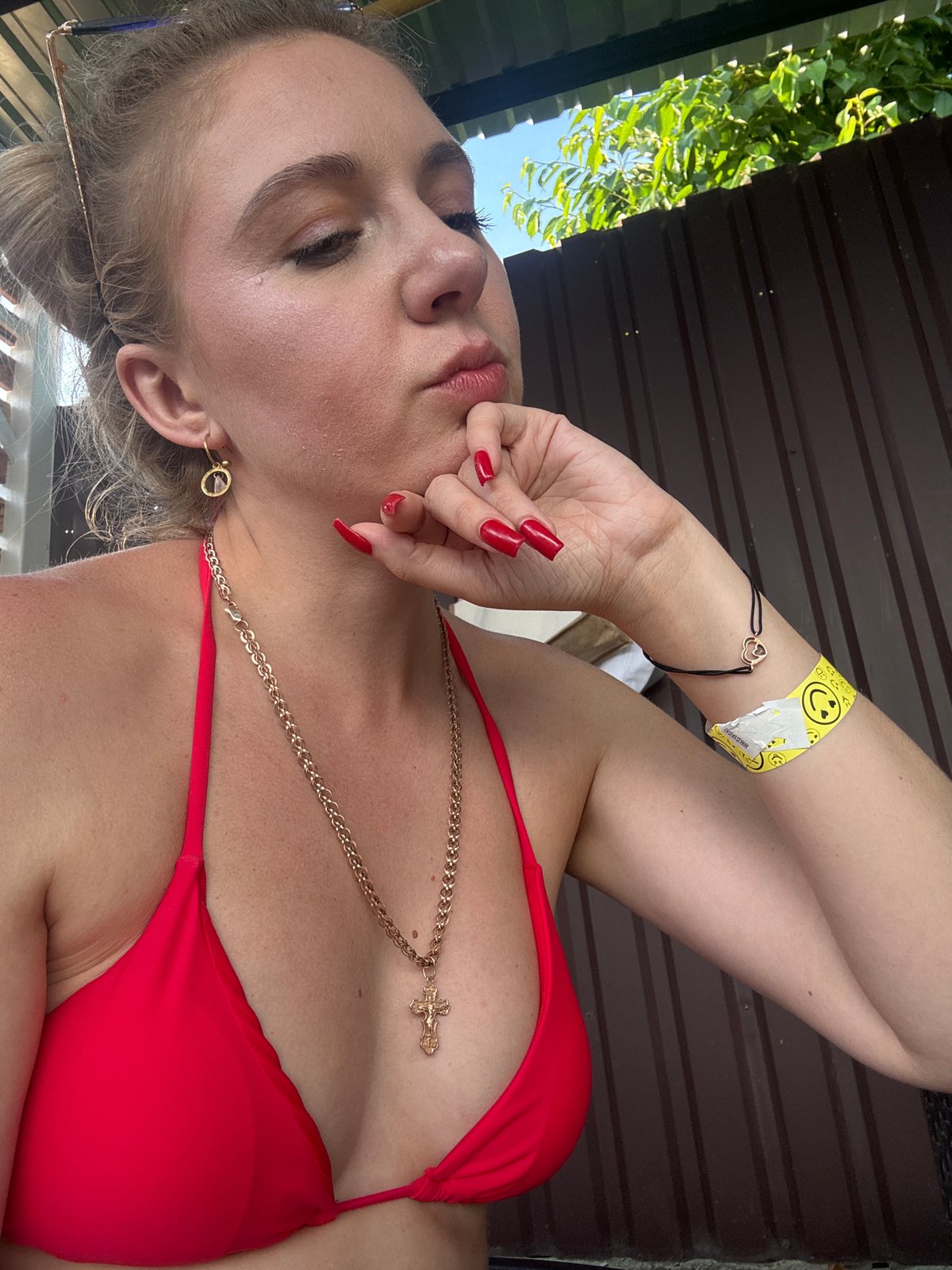 Poolside resort afternoon with red bikini and hanging chairs