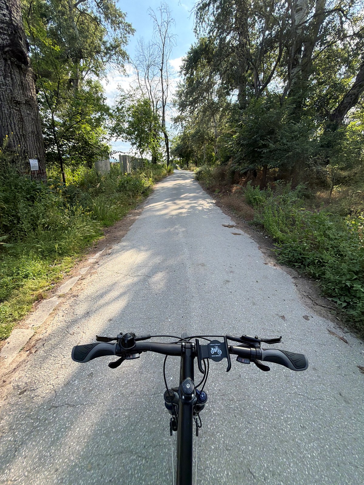 Cyclist documents peaceful journey along Plovdiv's tree-lined Rowing Canal path