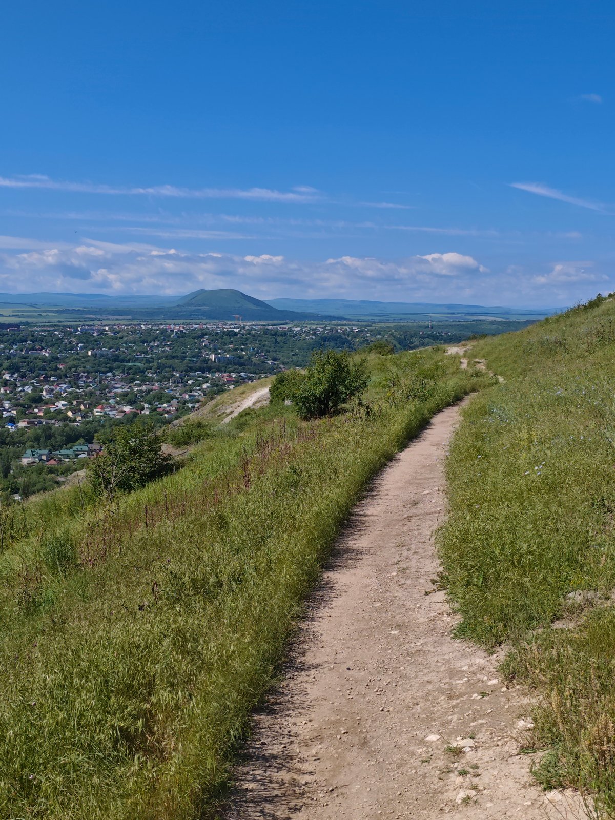 Morning hillside photography session captures Pyatigorsk cityscape and wildflowers