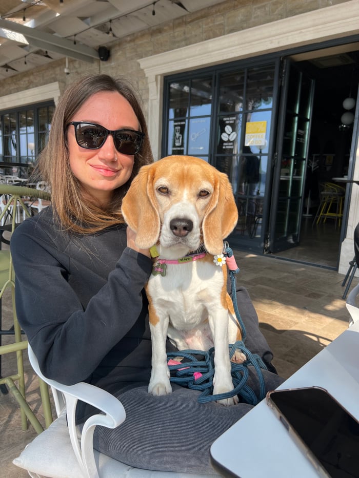 Woman and dog enjoy morning coastal tour in Montenegro