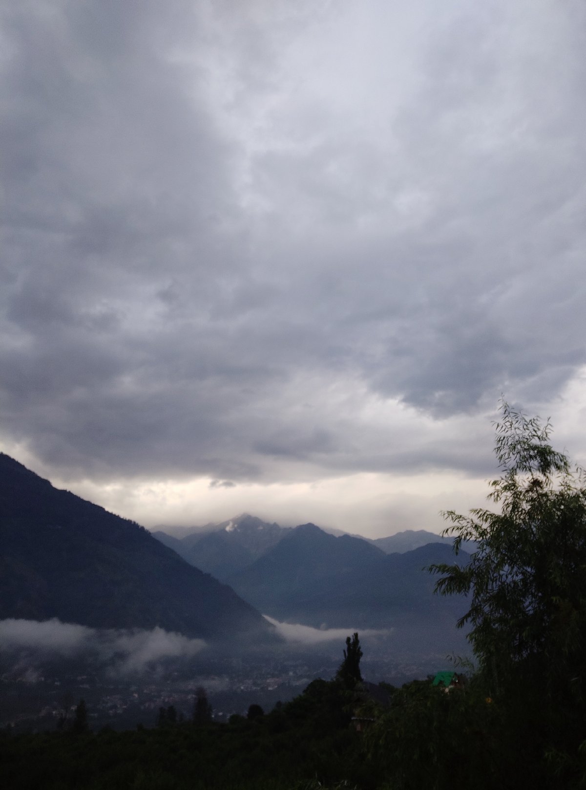 Visitor documents misty mountain morning in Patar, India