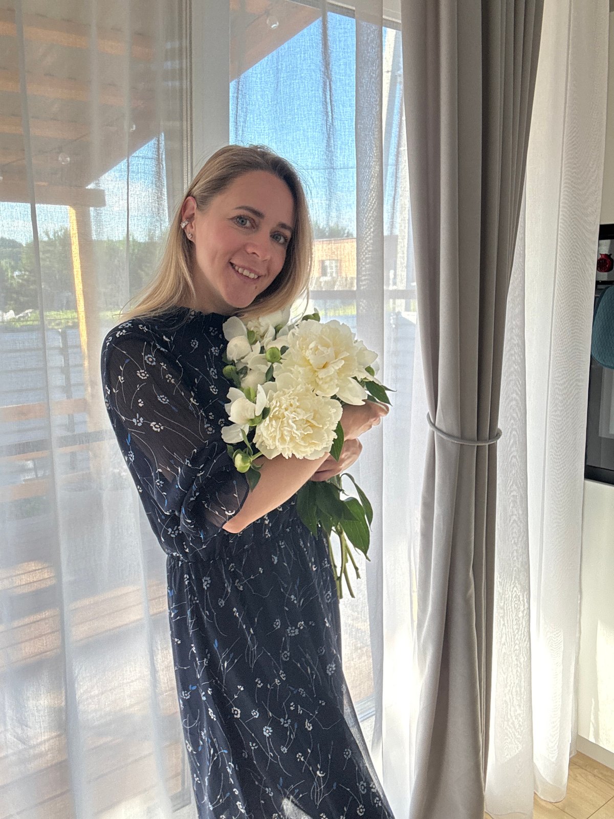 White peonies and a floral dress, photographed at home in Chaikovsky