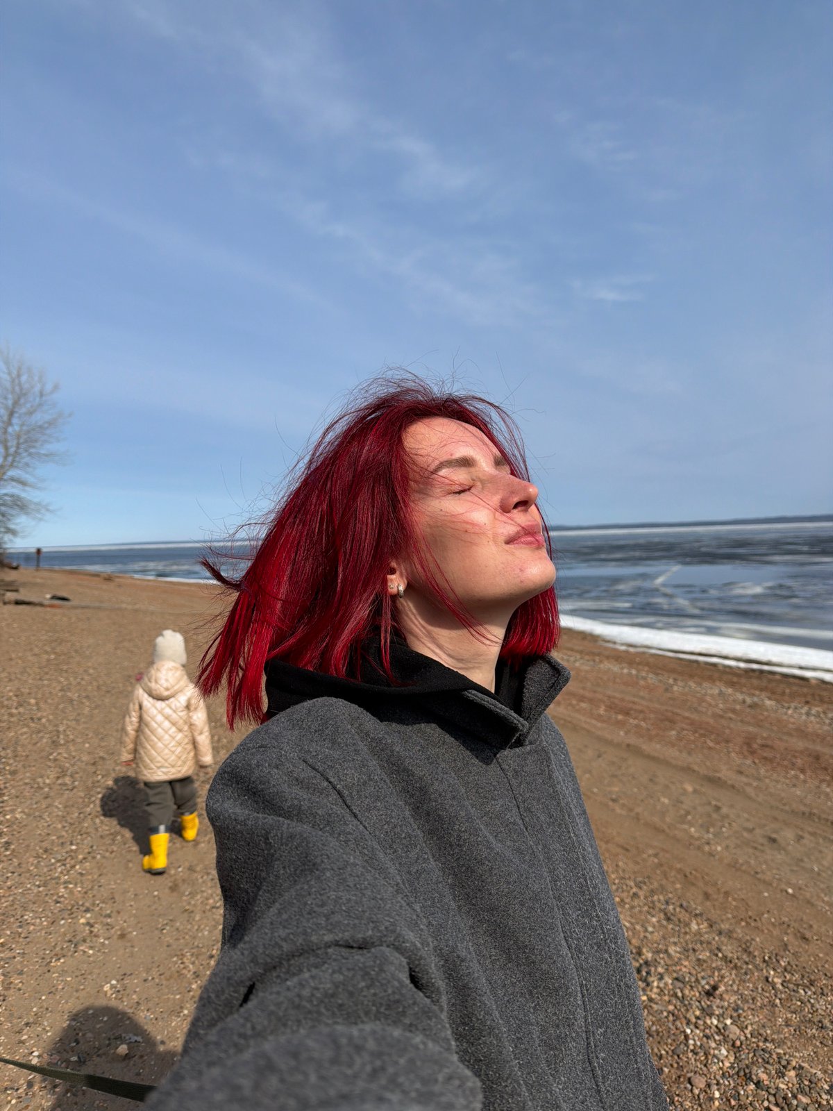 Woman films beach selfie with dog in Chaikovsky Russia