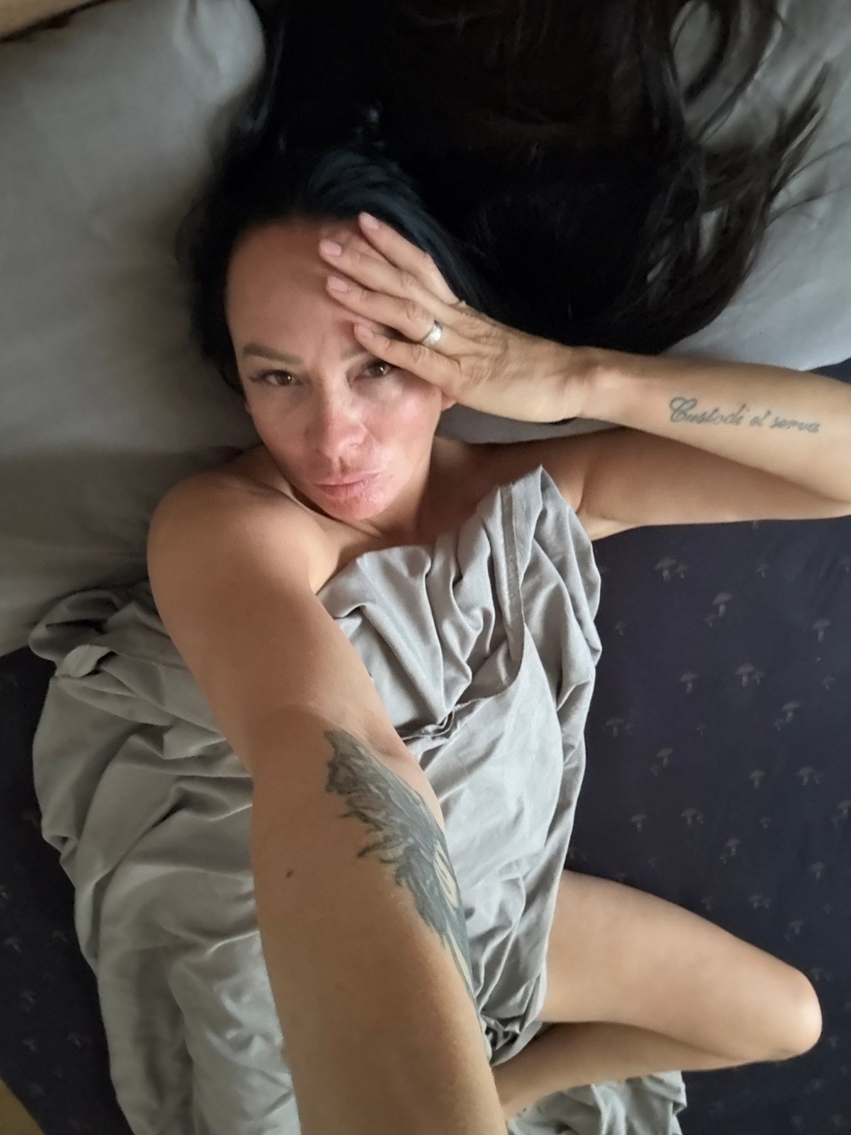Relaxed at-home moments on a patterned bed in Chaikovsky