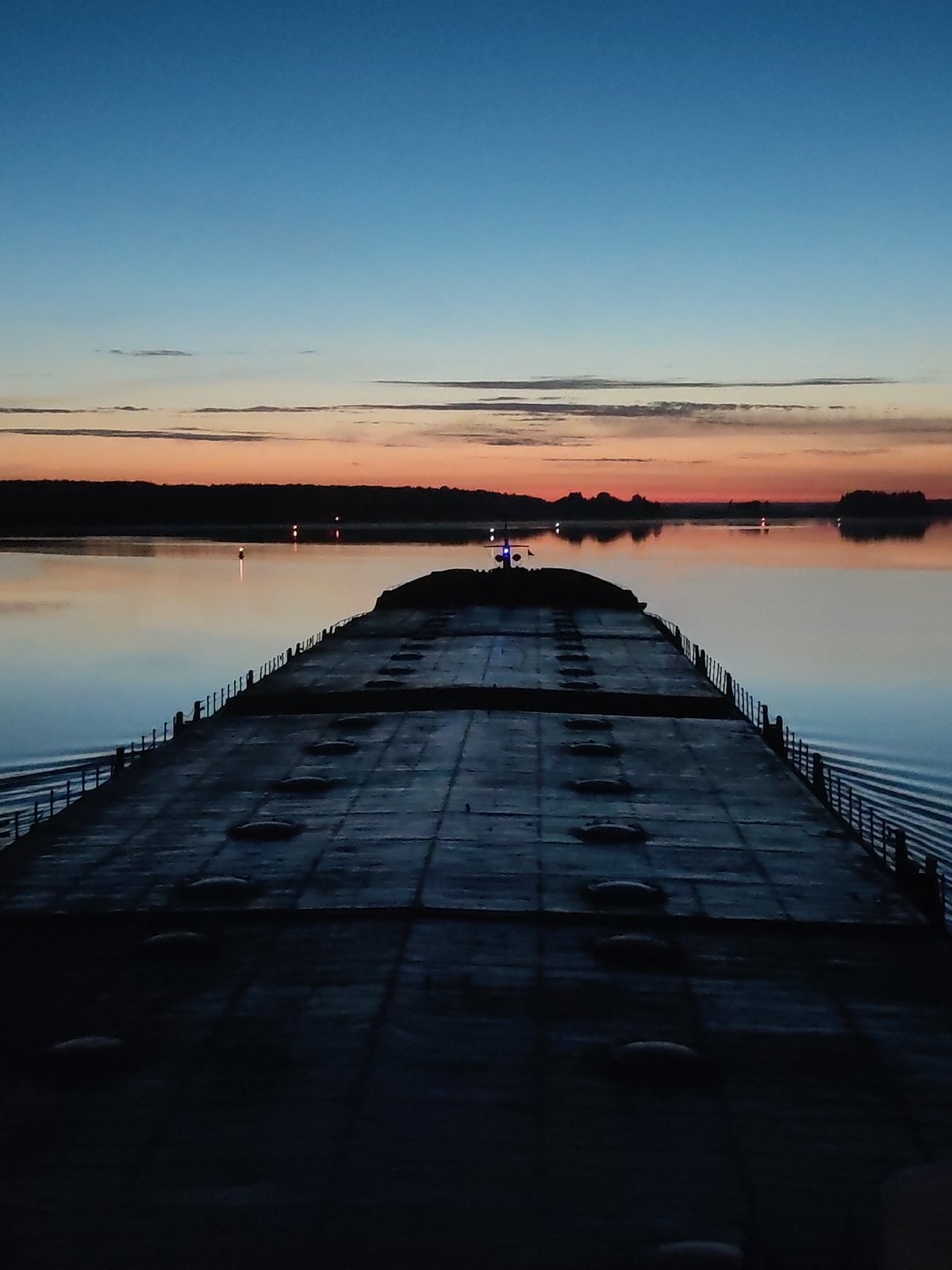 Nighttime barge and bridge activity documented on waterway
