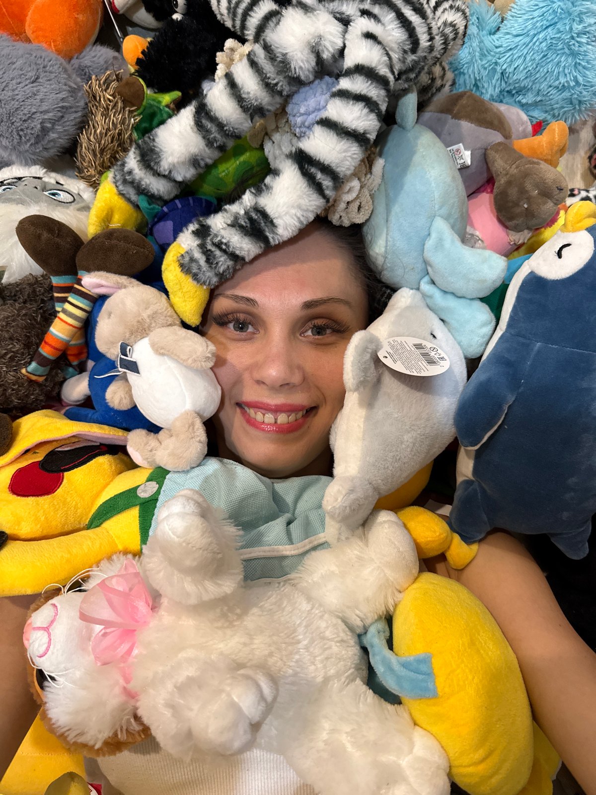 Woman poses with stuffed animal collection in Bor, Russia