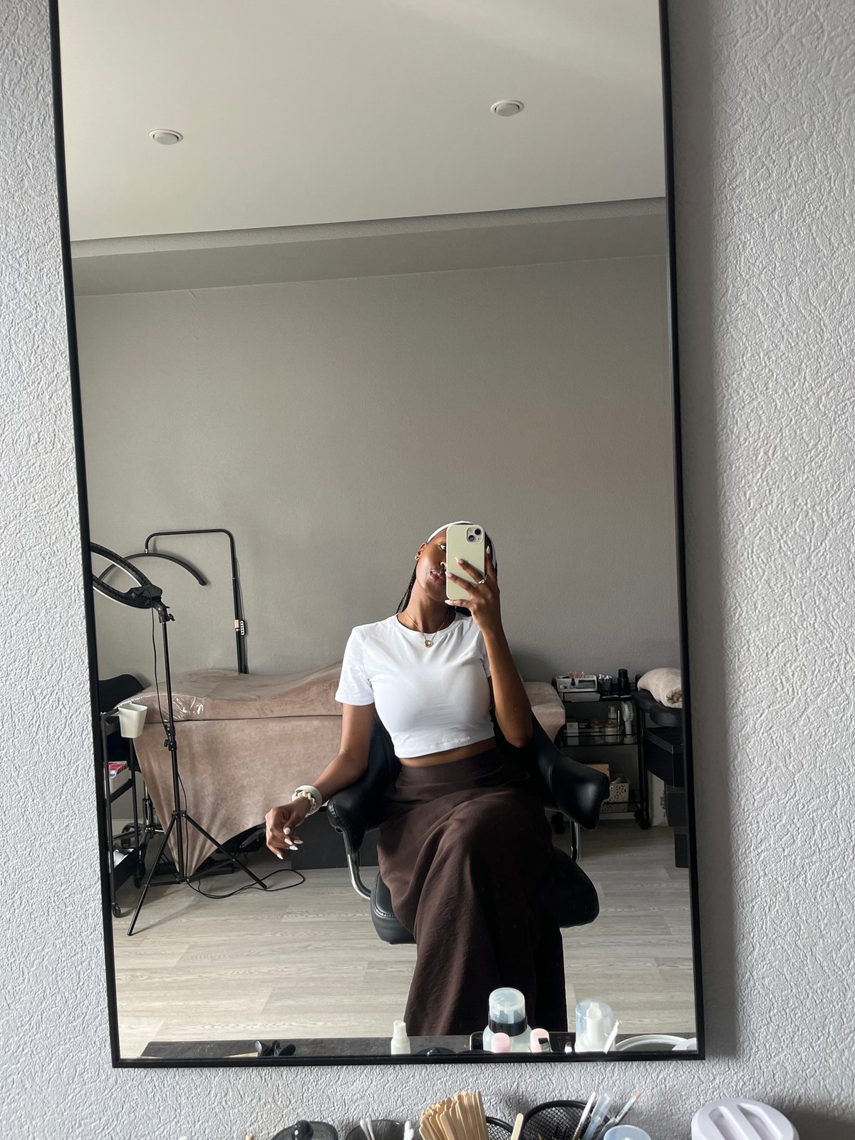 Woman takes mirror selfie in Kazan studio setting