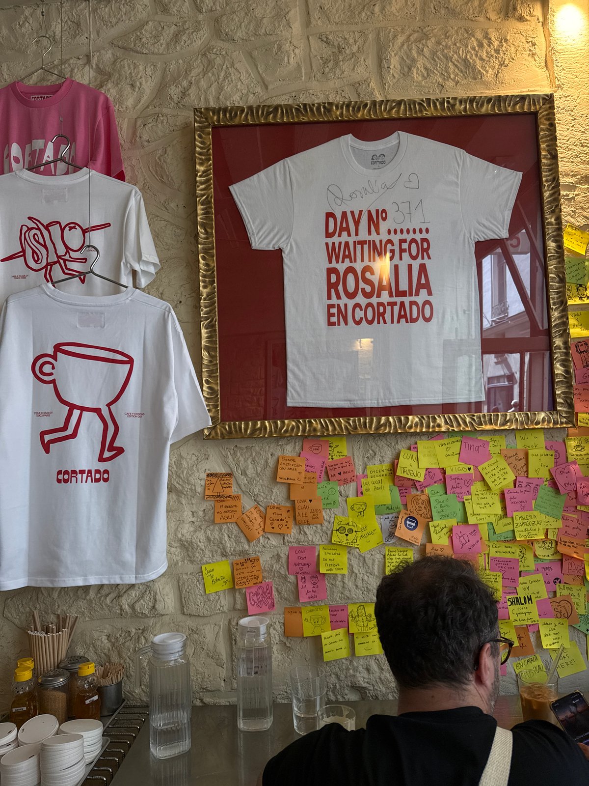 Memorial wall with sticky notes documented in Paris