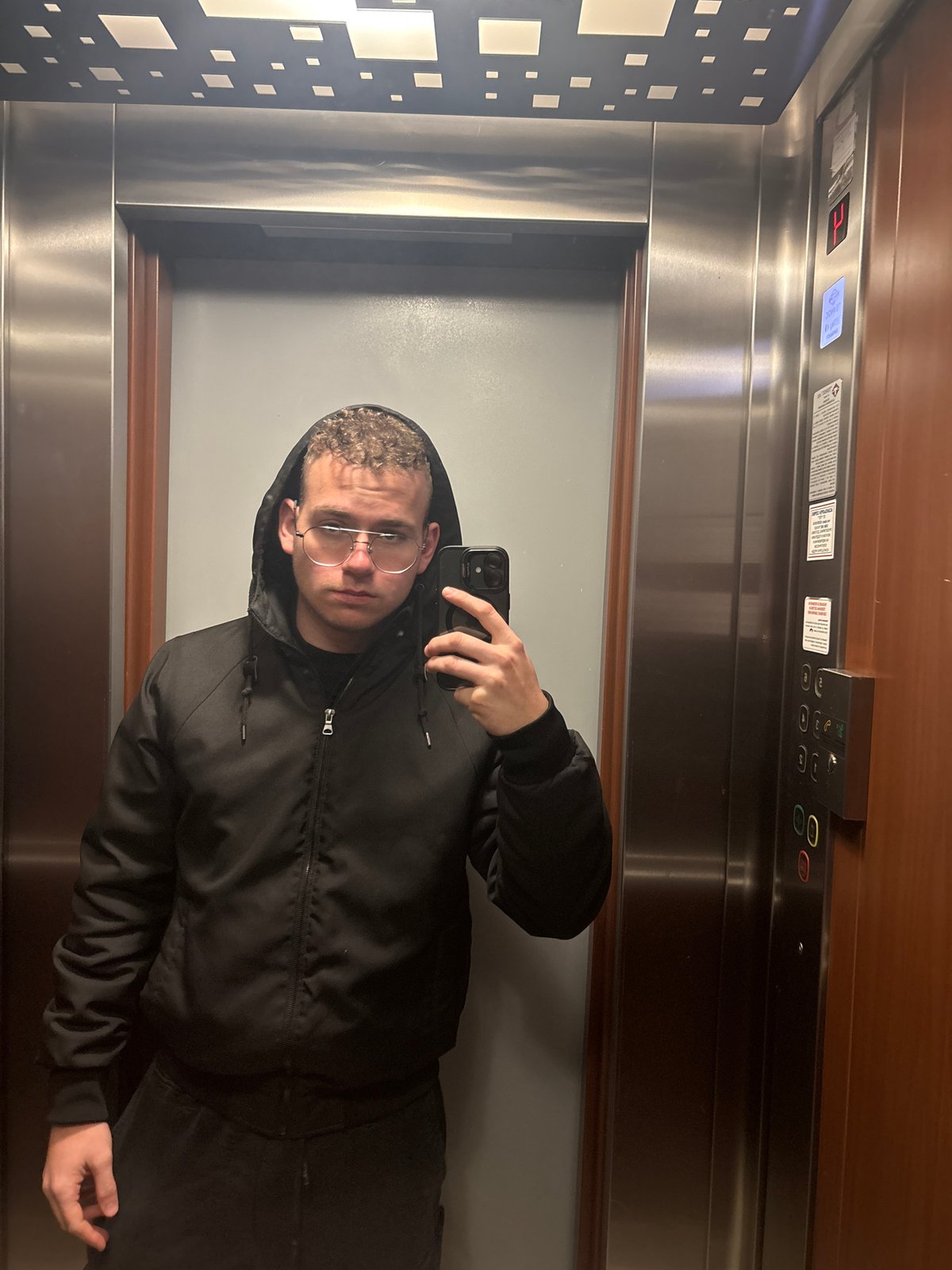 Young adult takes selfies in Plovdiv elevator