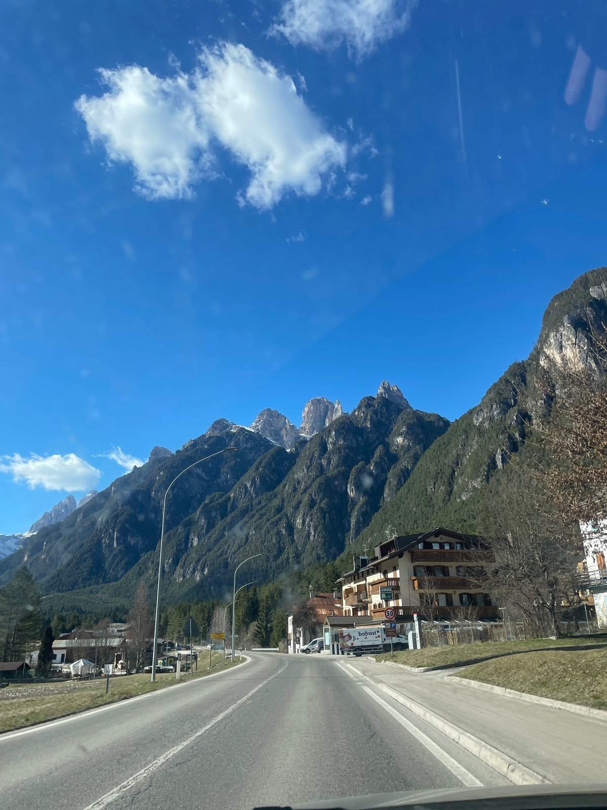 Woman travels scenic mountain road in Auronzo di Cadore