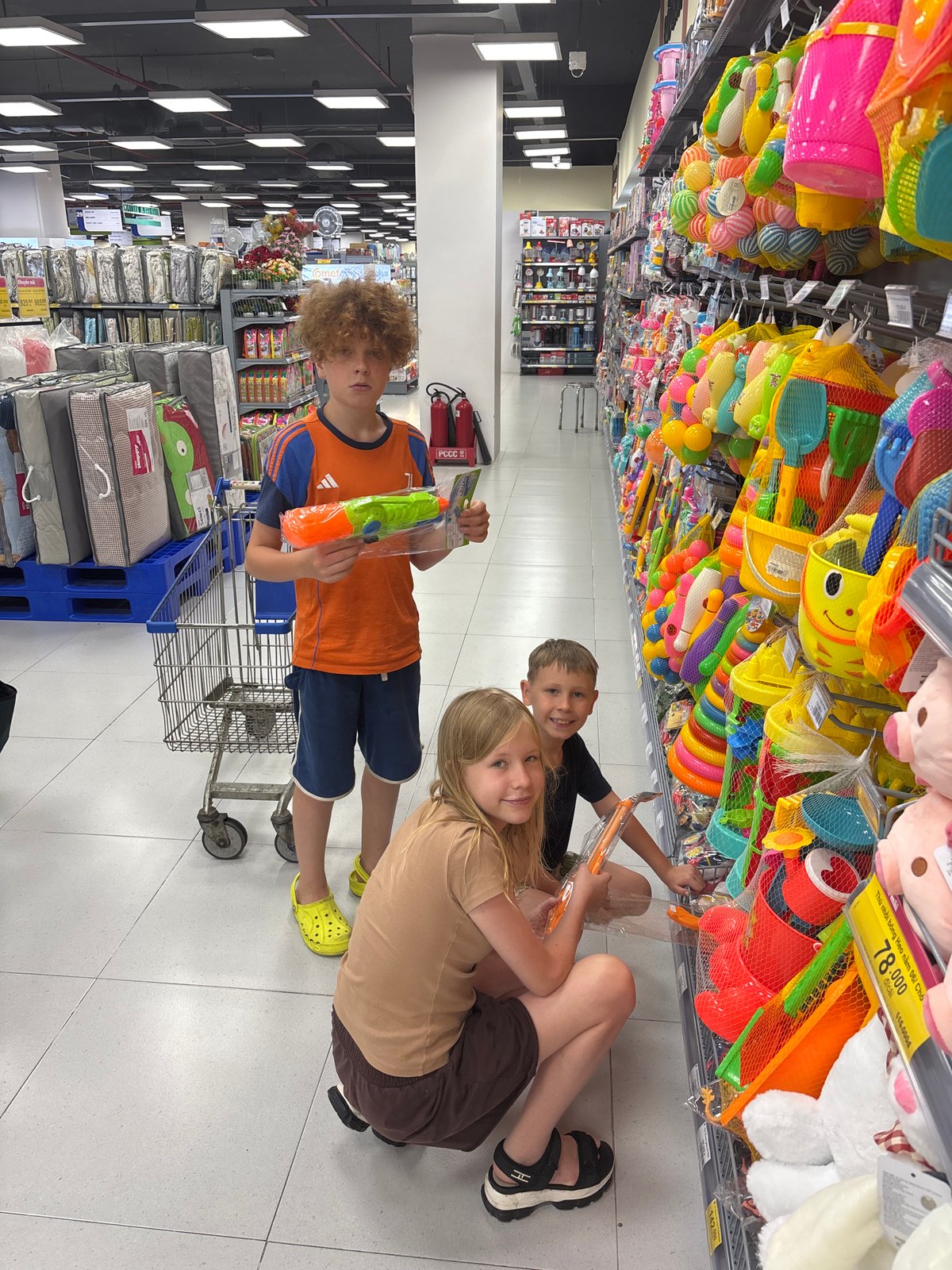 Kids pick out toys at a Phan Thiết hypermarket