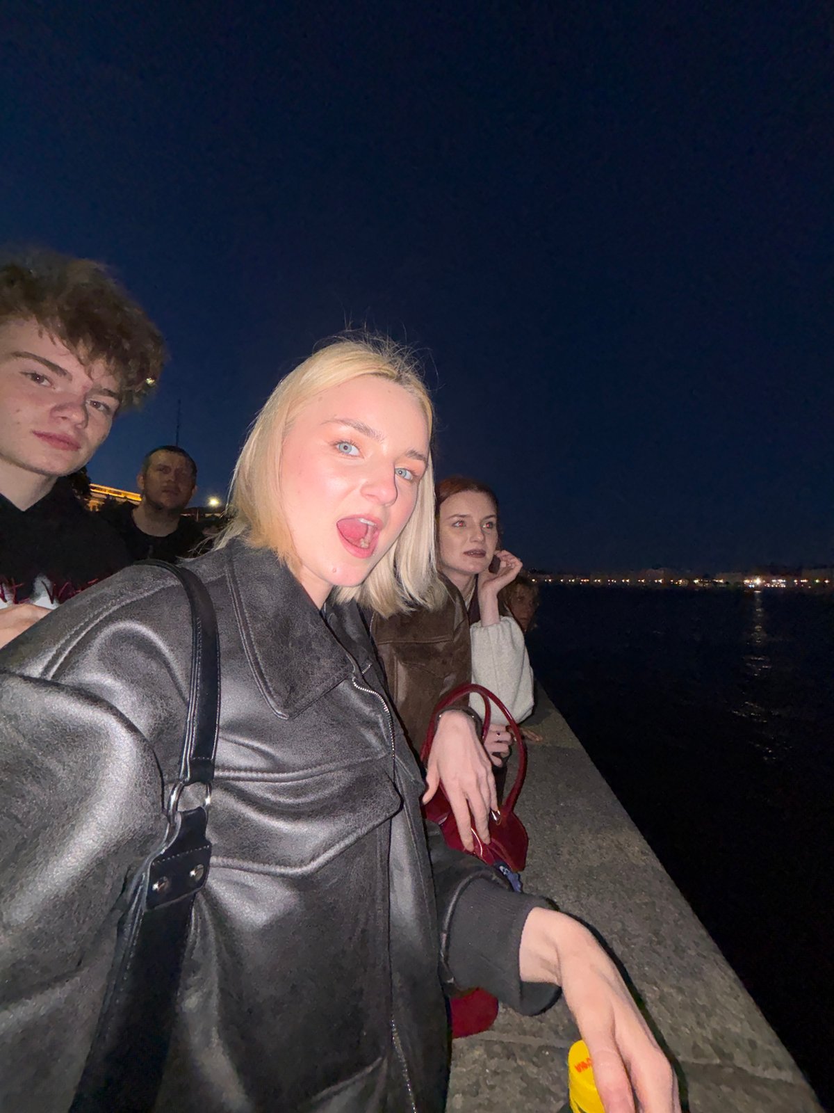 Summer white night hangout along Saint Petersburg's Neva embankment
