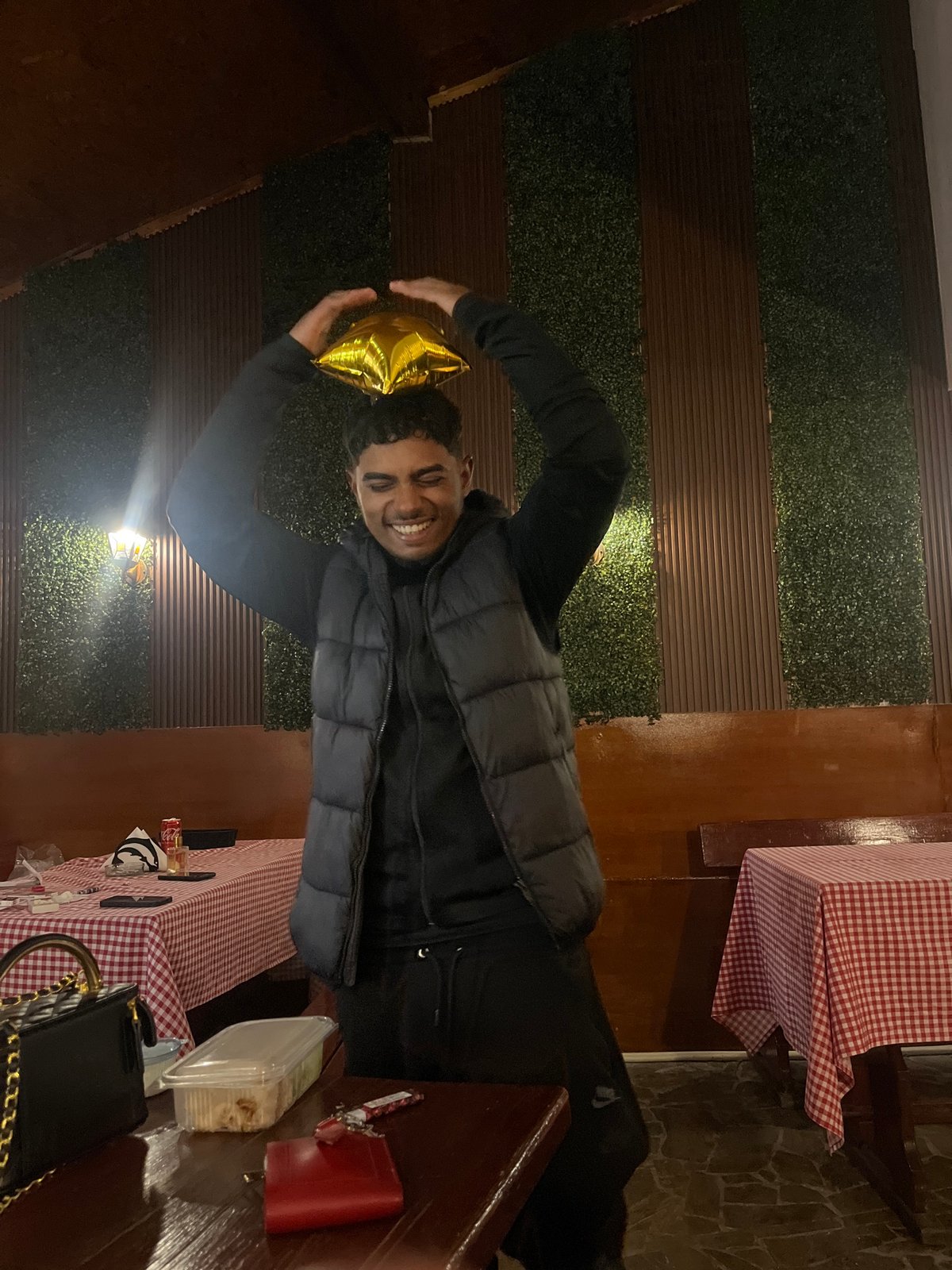 Man celebrates with gold star balloon in Bulgarian town