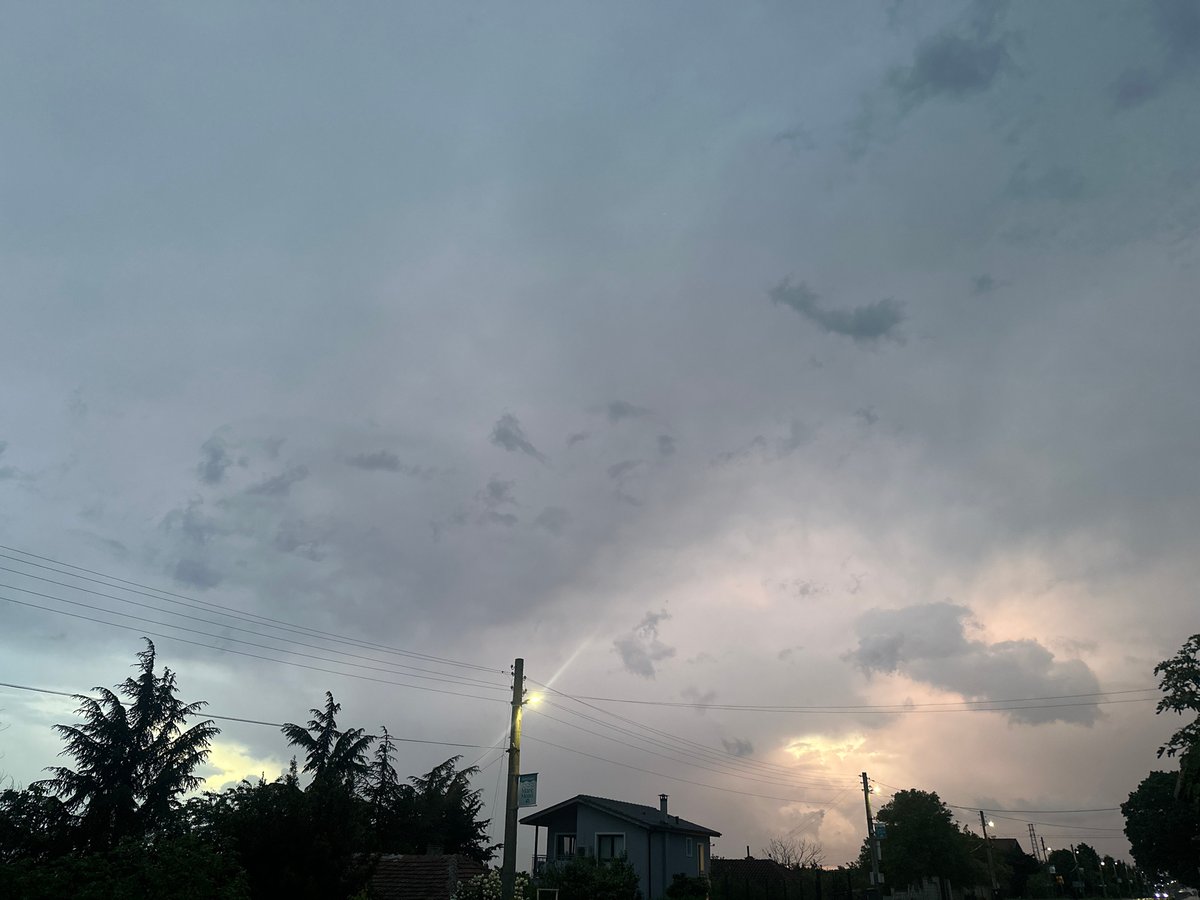 Evening storm clouds gather over wet streets in Byala
