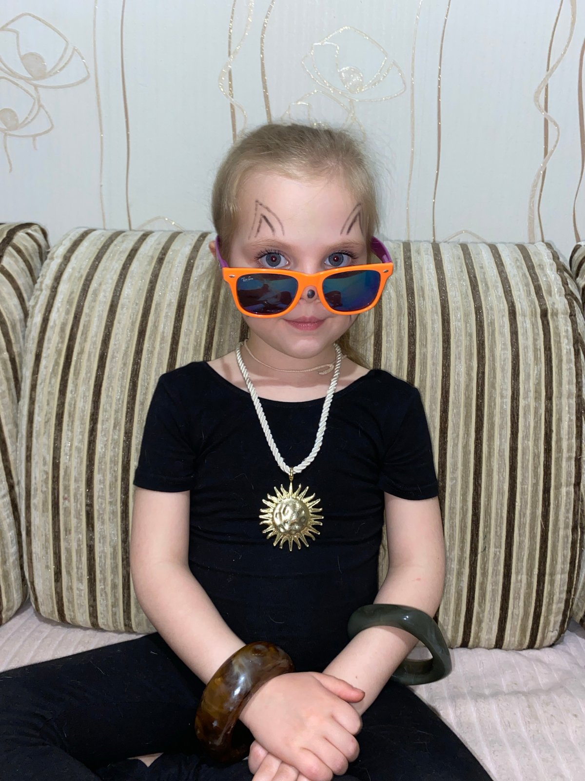Child and puppy share playful moments in Votkinsk home