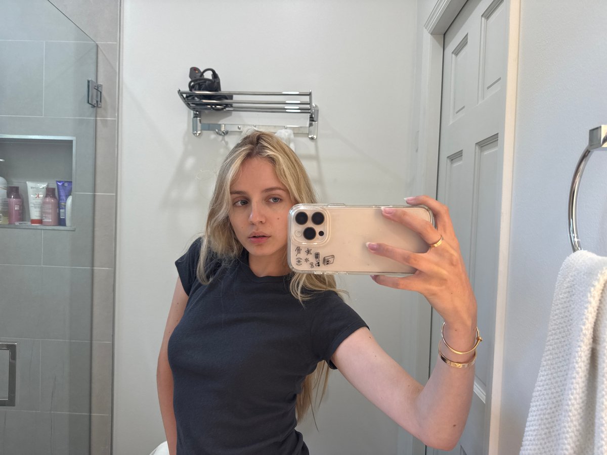 Mirror selfie series in a Miami bathroom, gold jewelry on.