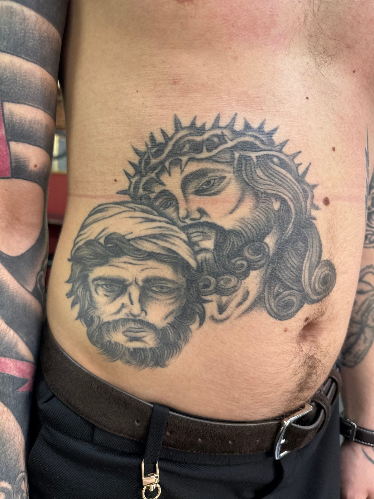 Detailed tattoo artwork photographed on person's torso in Moscow