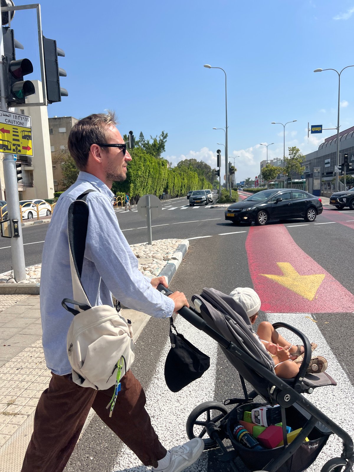Morning errand with a stroller in Kiryat Bialik, police presence nearby