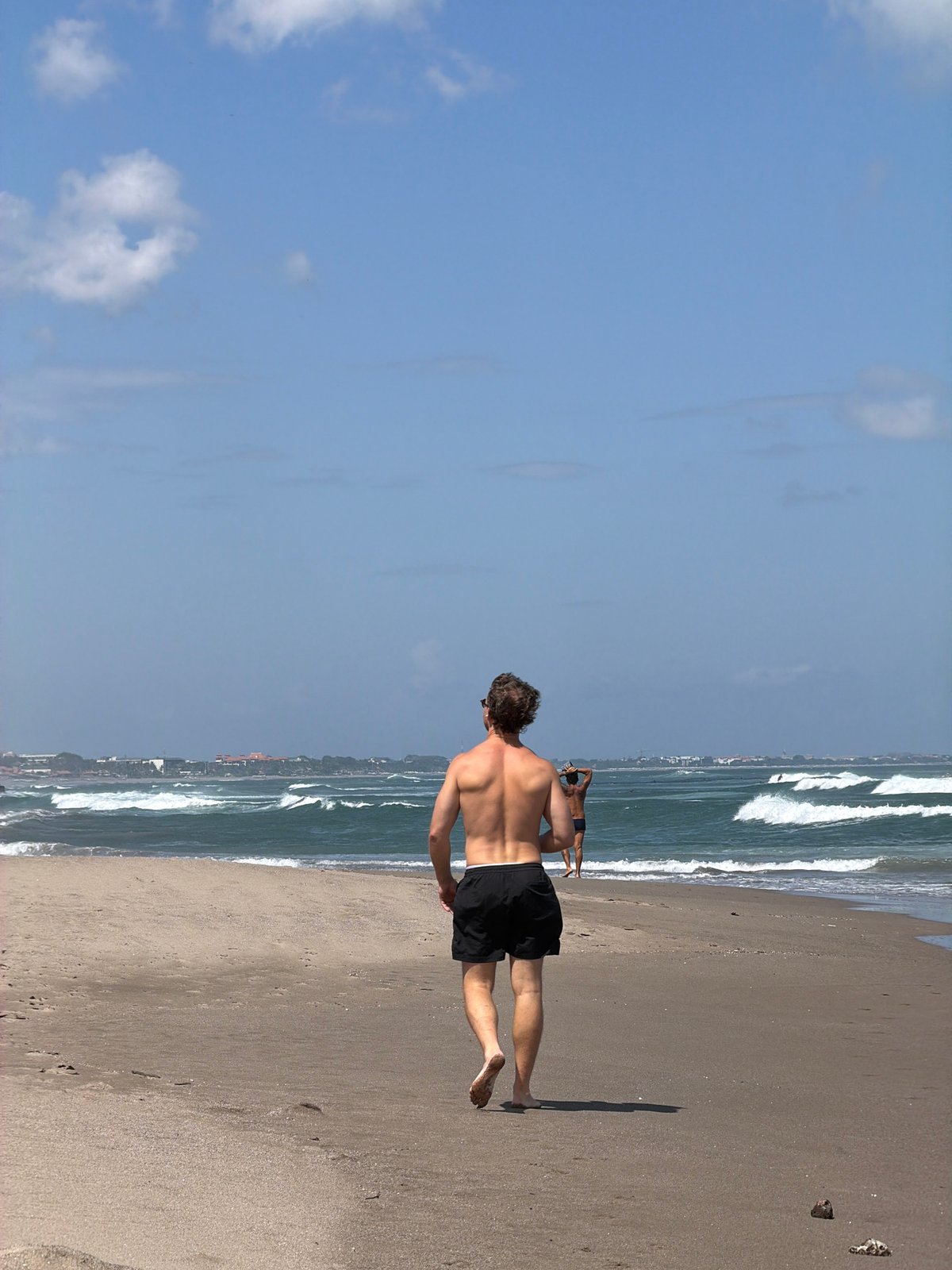 Beach day in North Kuta — surf, sand, and a lantern-lit restaurant