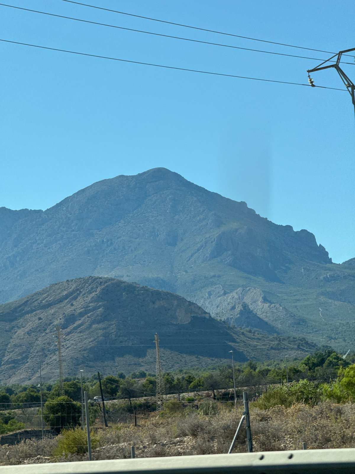 Mountain scenery rolls past on a drive near Benidorm