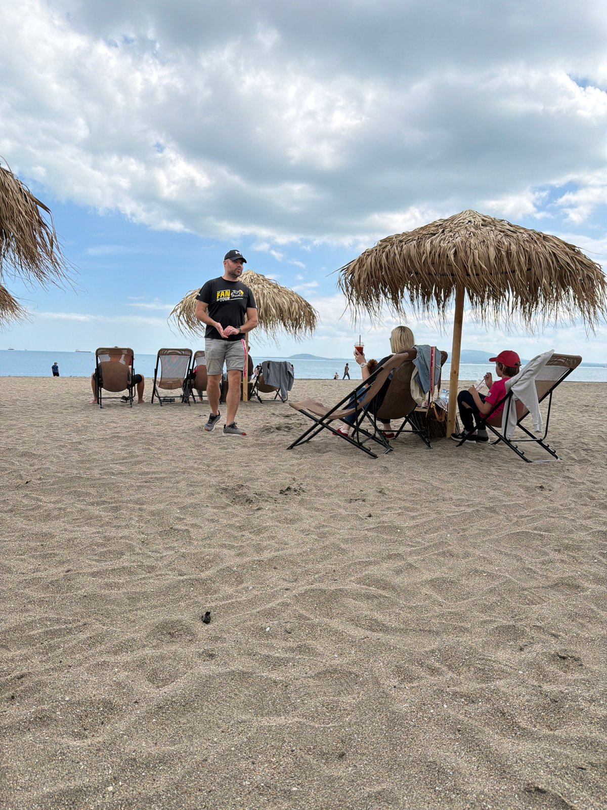 Weekend beach and street life documented at coastal location