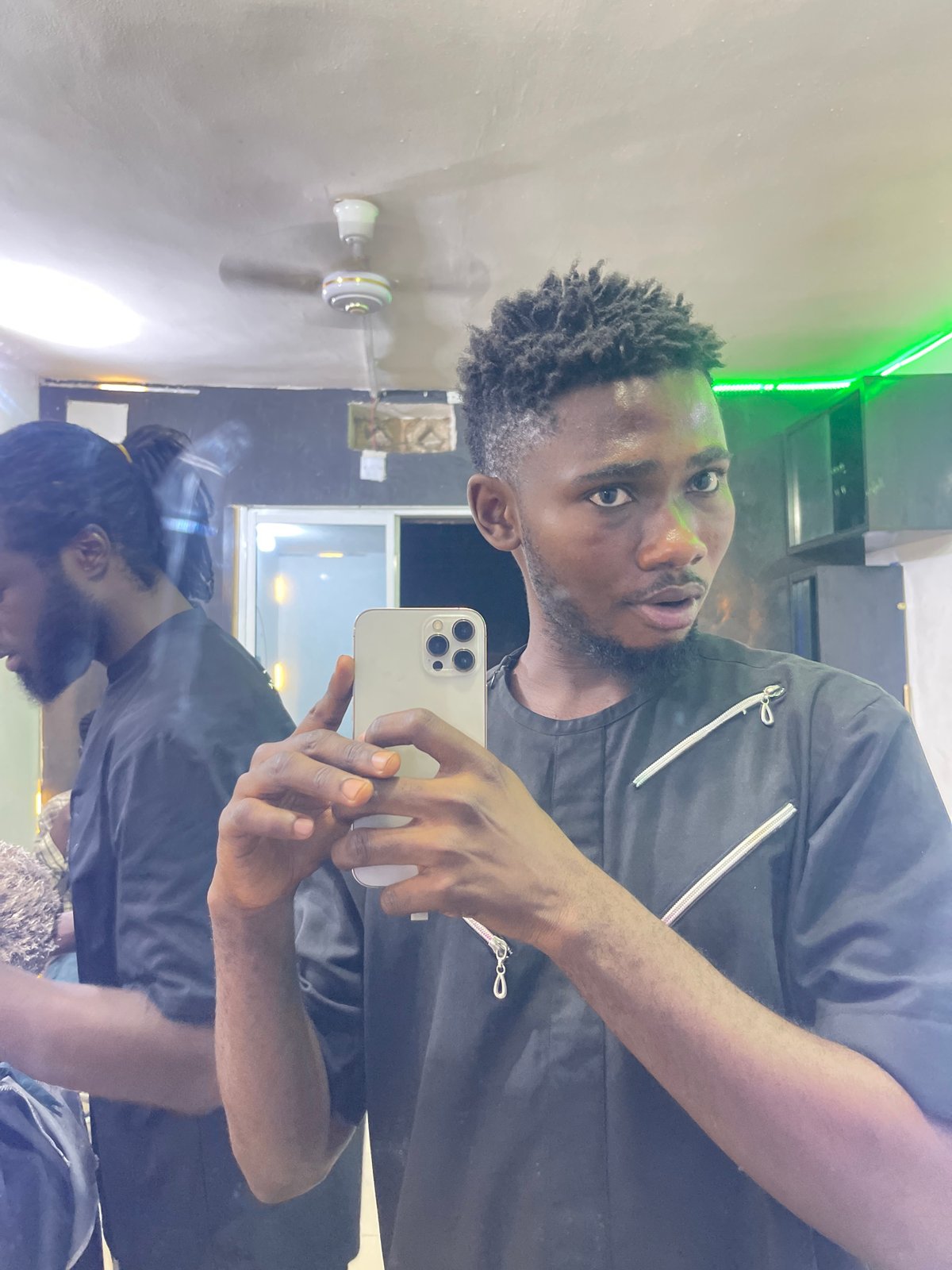 Evening barbershop and recreation scenes documented in Nigerian neighborhood