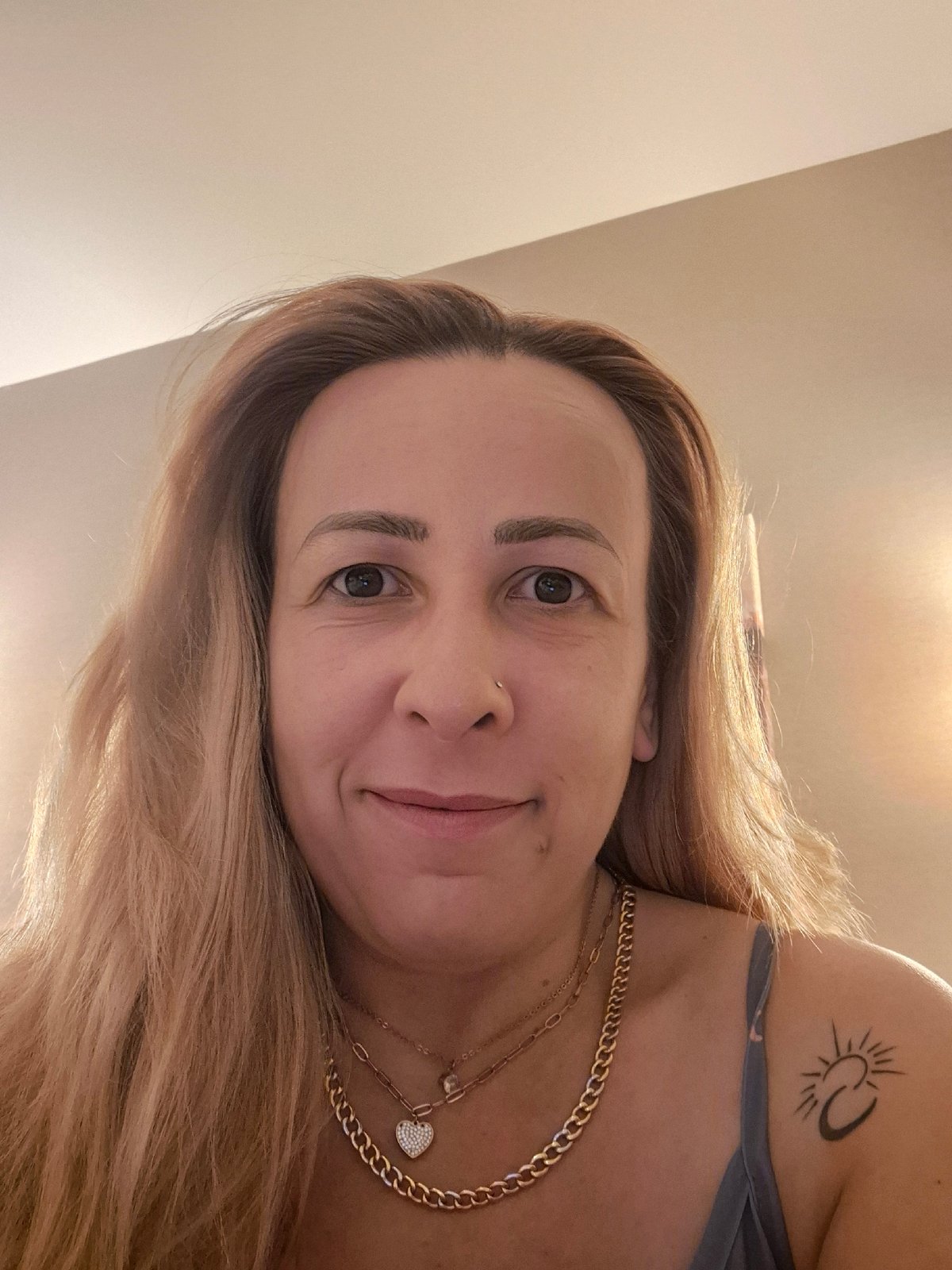 Bedroom selfie series with celestial top and gold jewelry