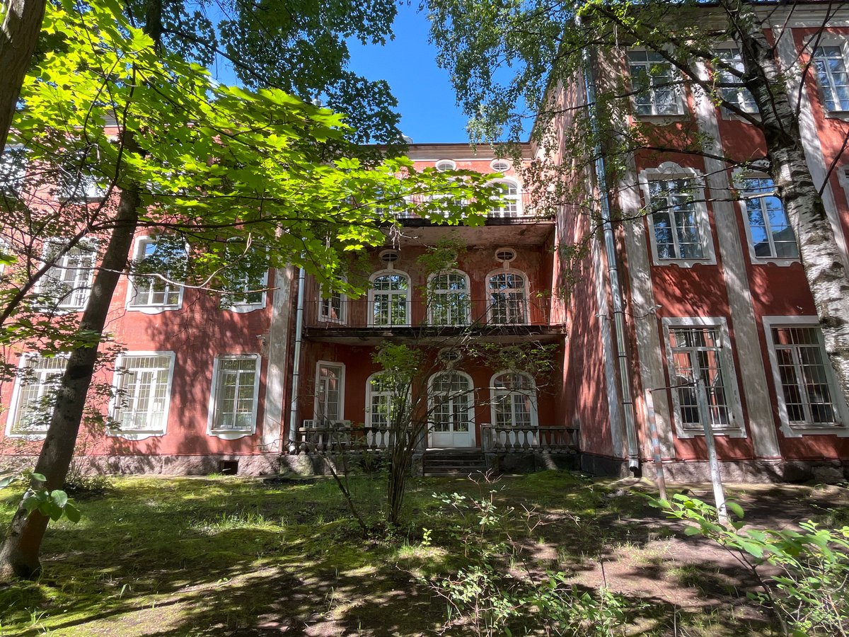 Historic red mansions and park grounds, Saint Petersburg summer morning