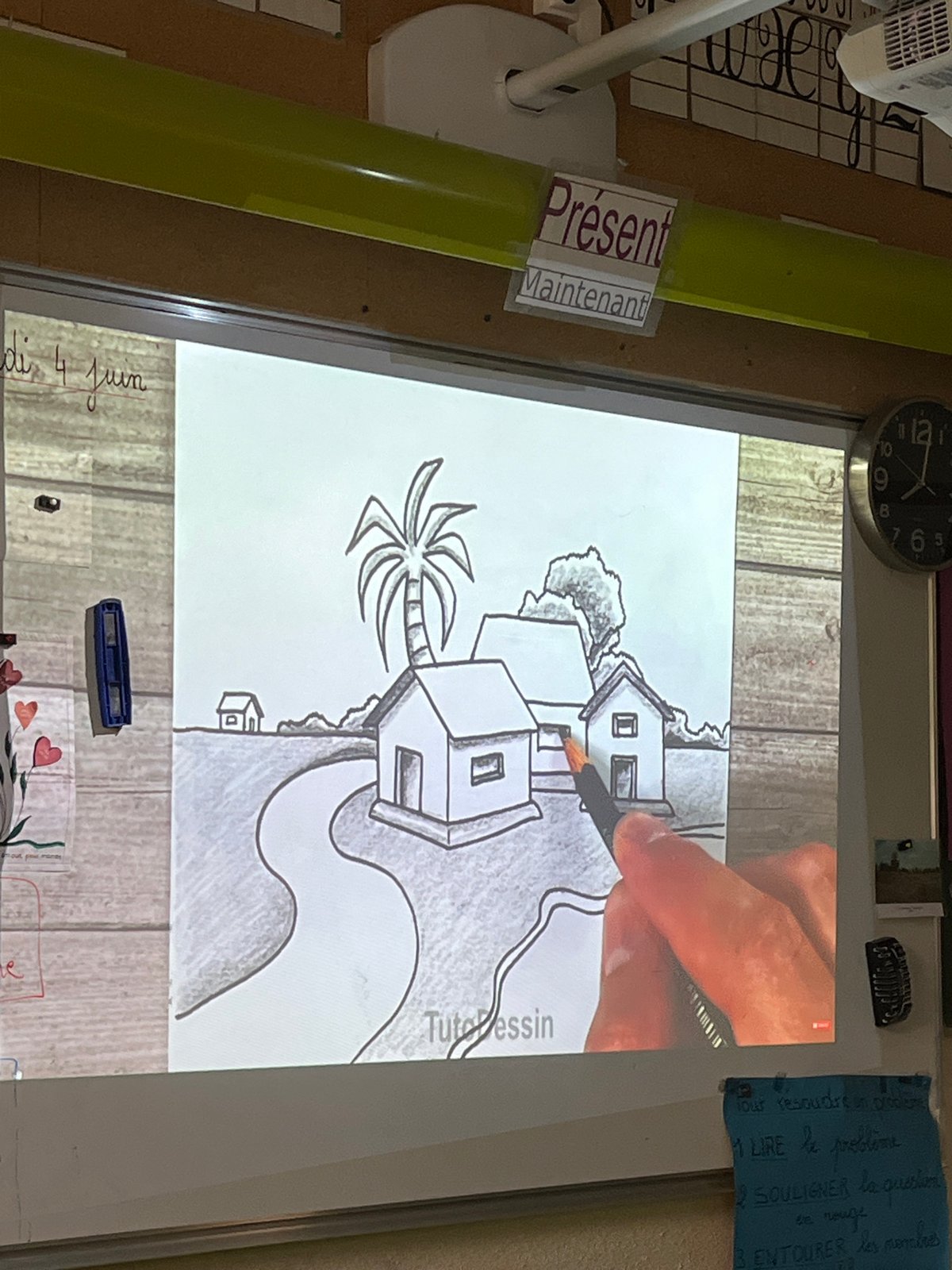 Art lesson captures village drawing tutorial in French classroom