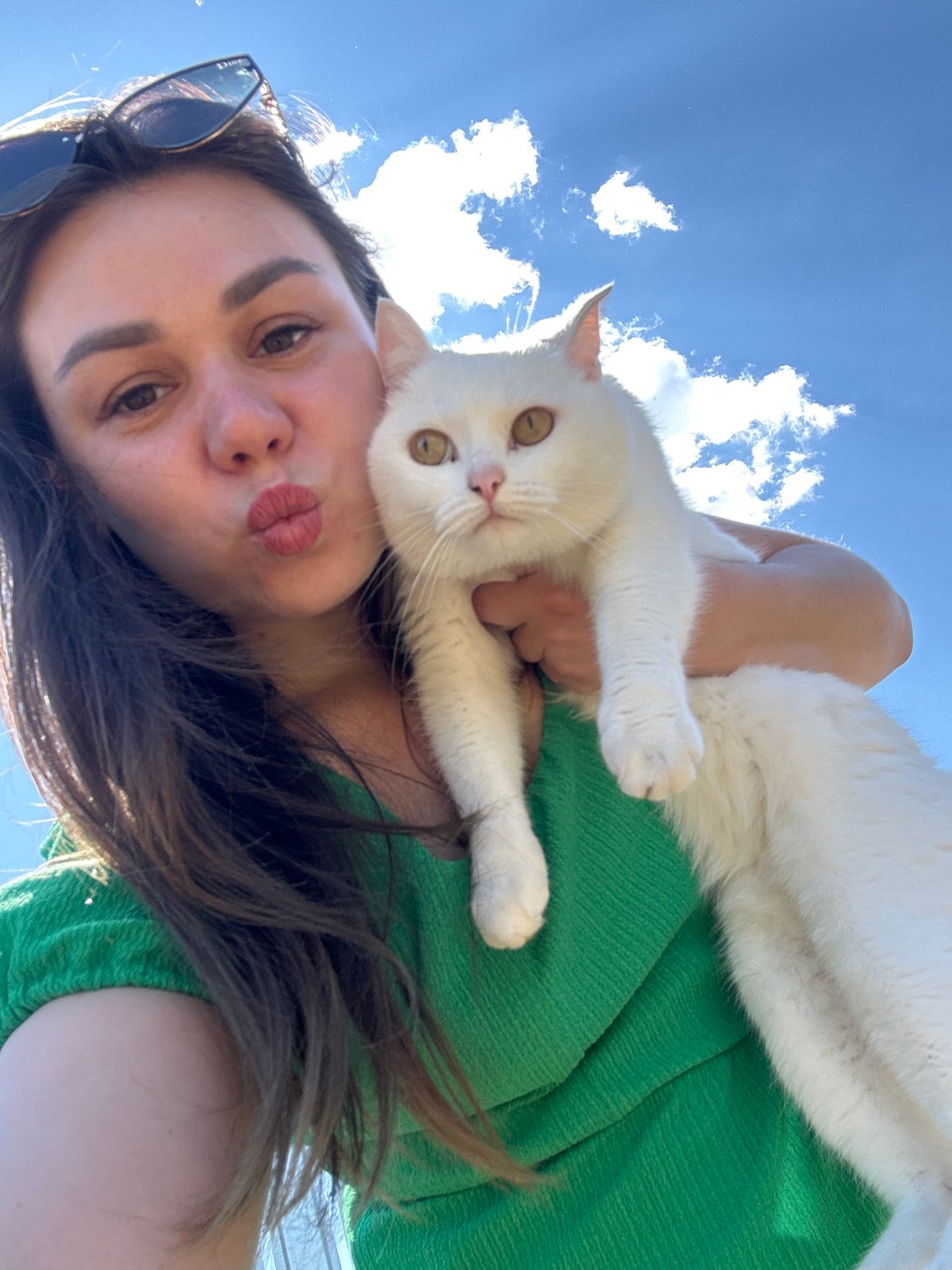 Woman and white cat share quiet morning moment in Chaikovsky