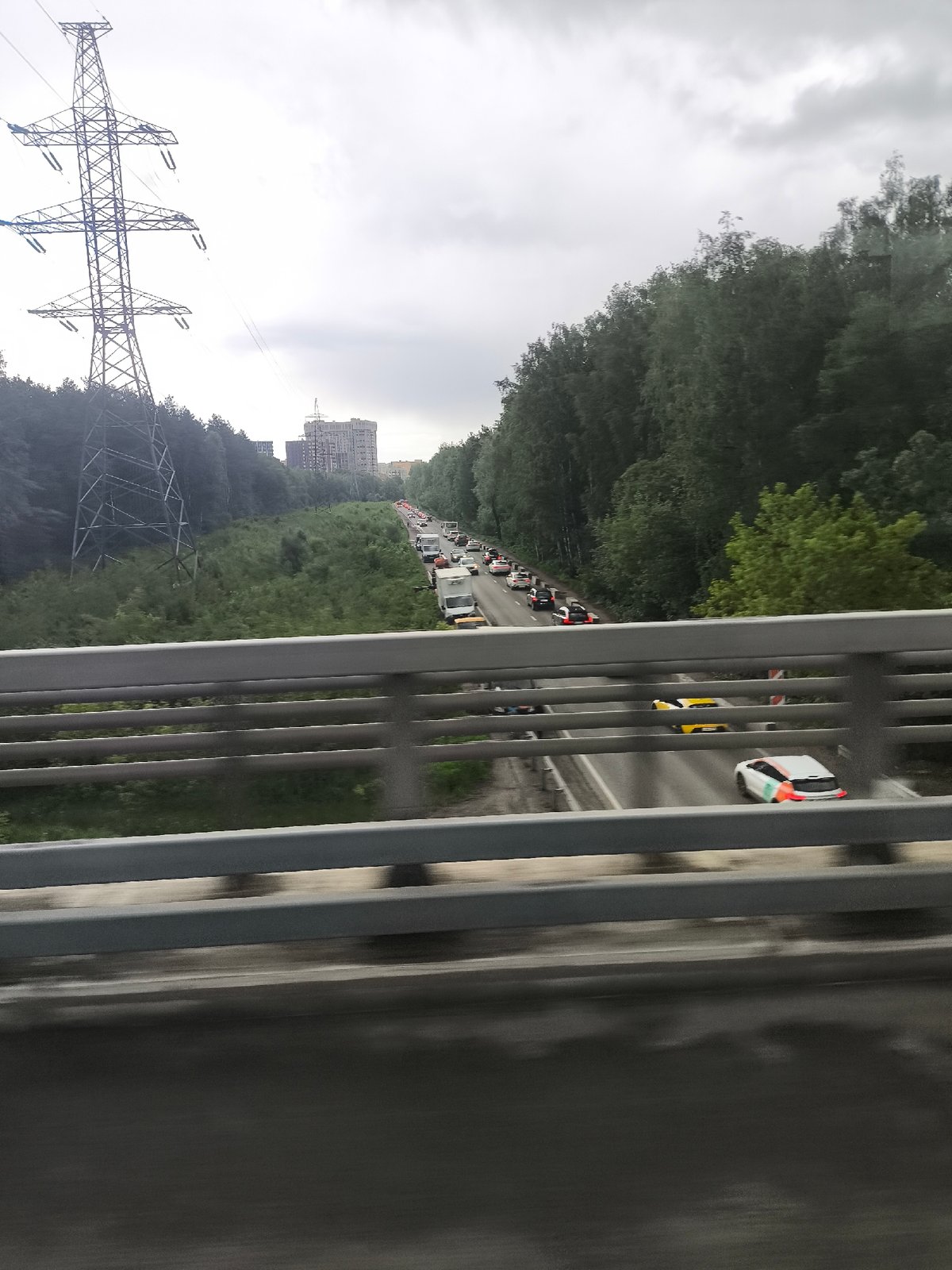 Urban infrastructure observed across metro area under stormy skies