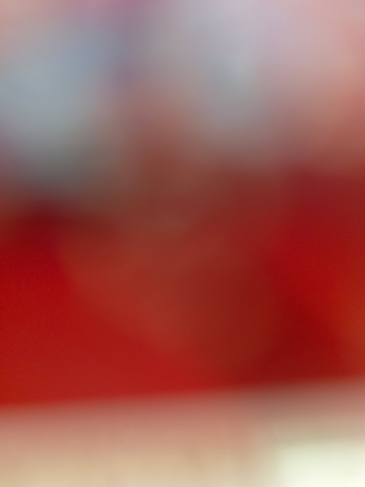 Blurred images show red tones, light source, plaid fabric