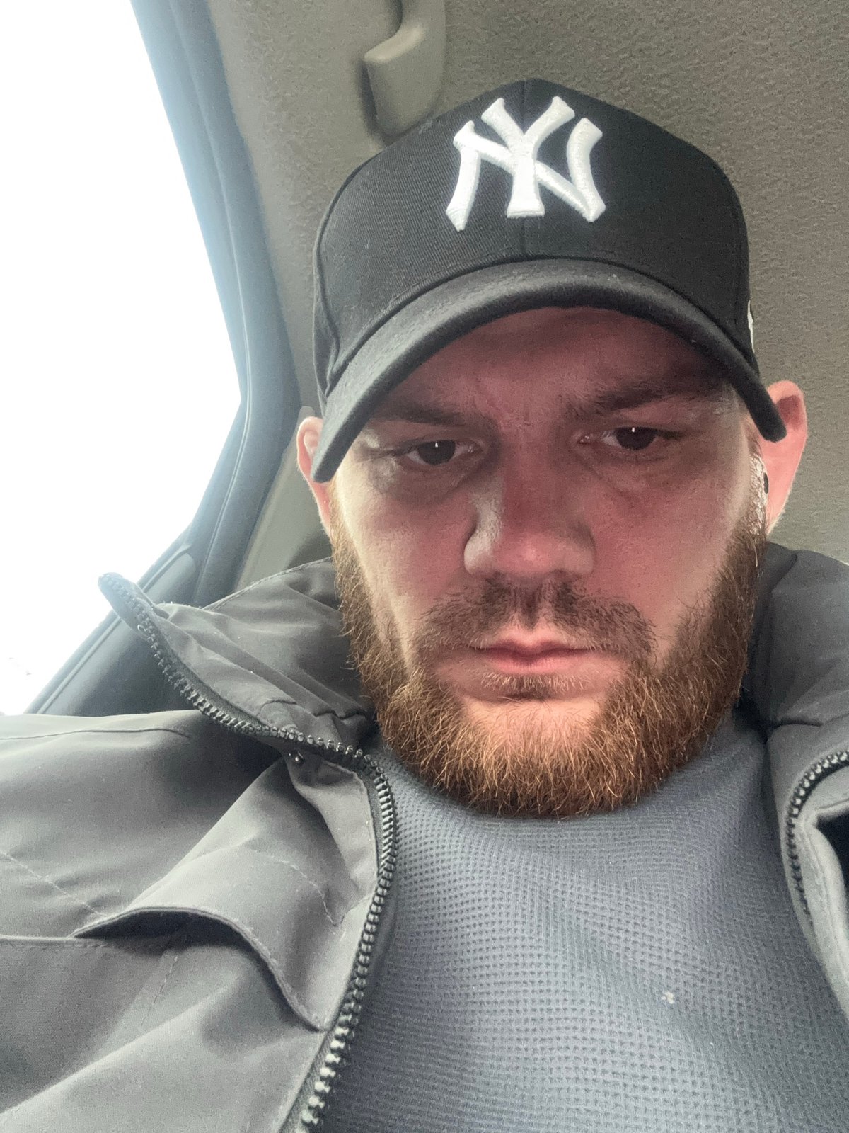Man in NY cap photographed in vehicle in Perm
