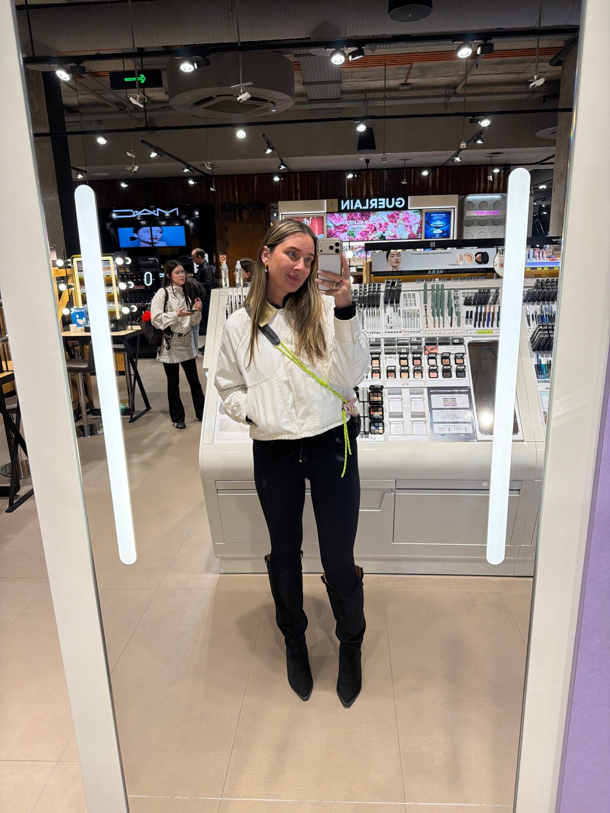 Woman takes selfies at Moscow cosmetics store