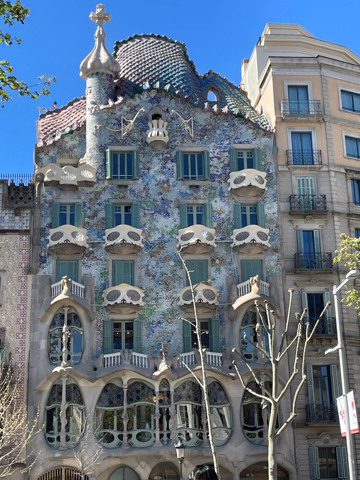Tourists document iconic Gaudí building Casa Batlló in Barcelona
