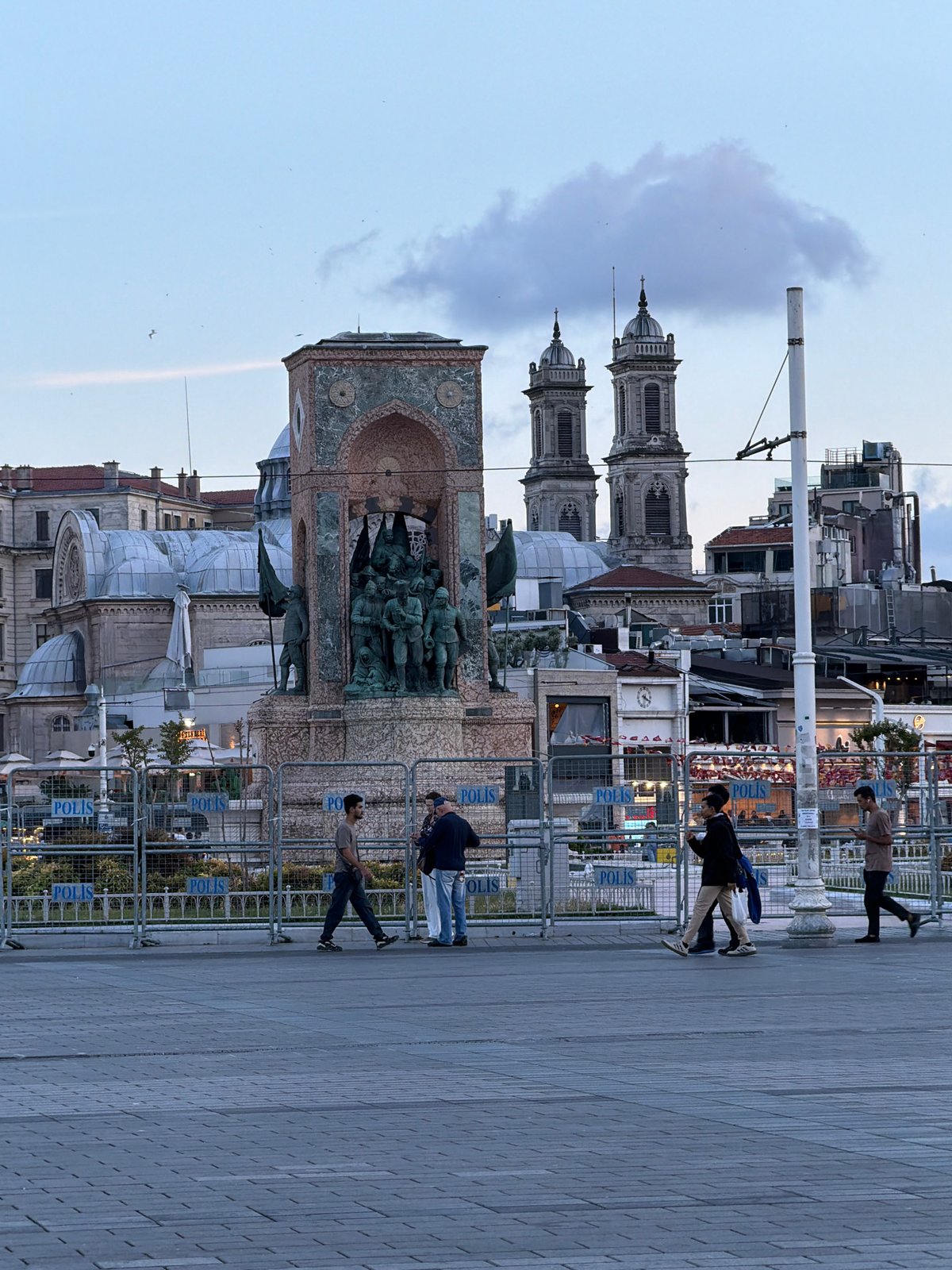 Evening scenes captured at Istanbul's Taksim Square with police presence