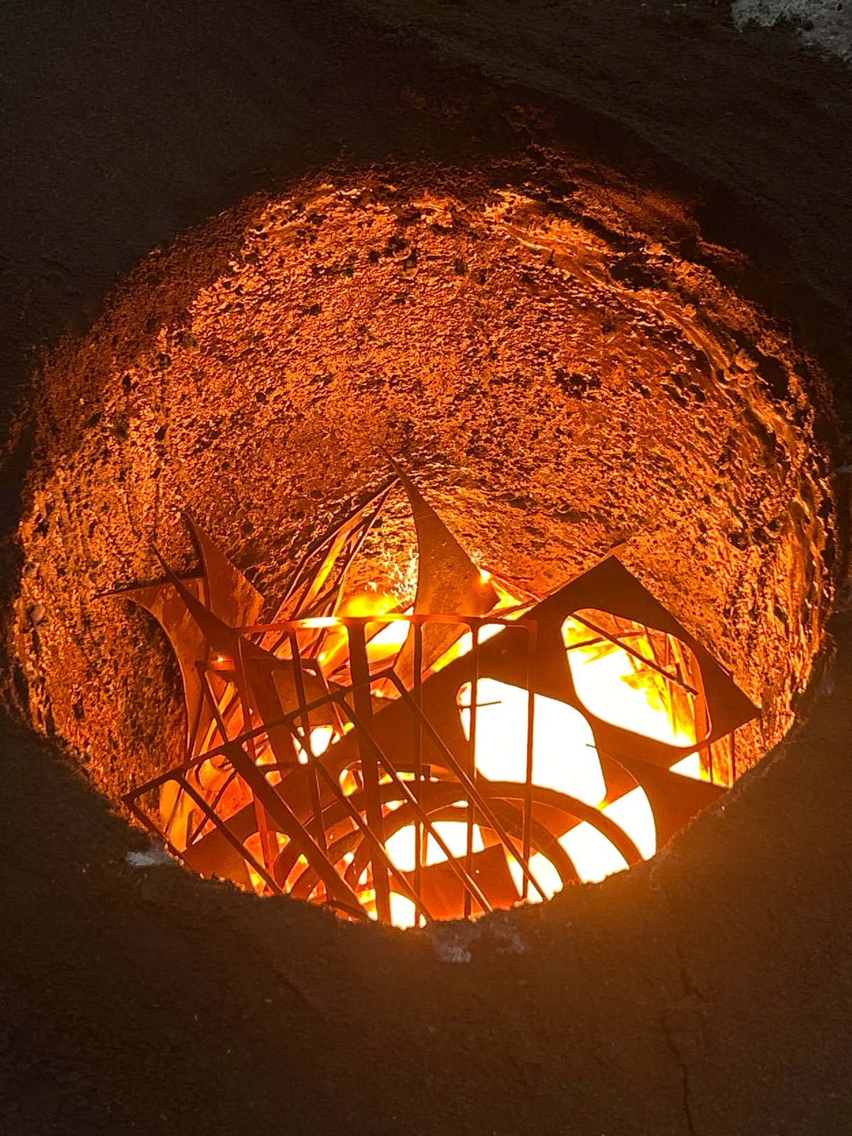 Cylindrical earthen structure with illuminated metal interior documented in Russia