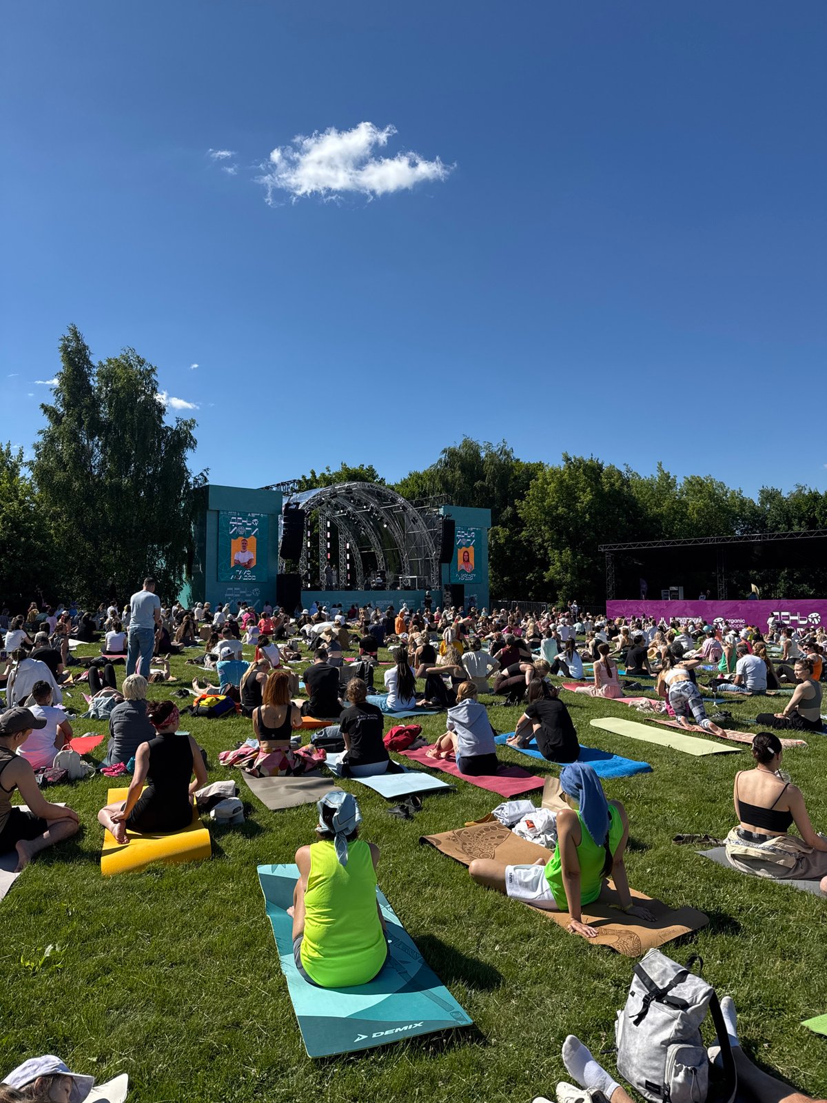 Mass outdoor yoga gathering at a Moscow park stage