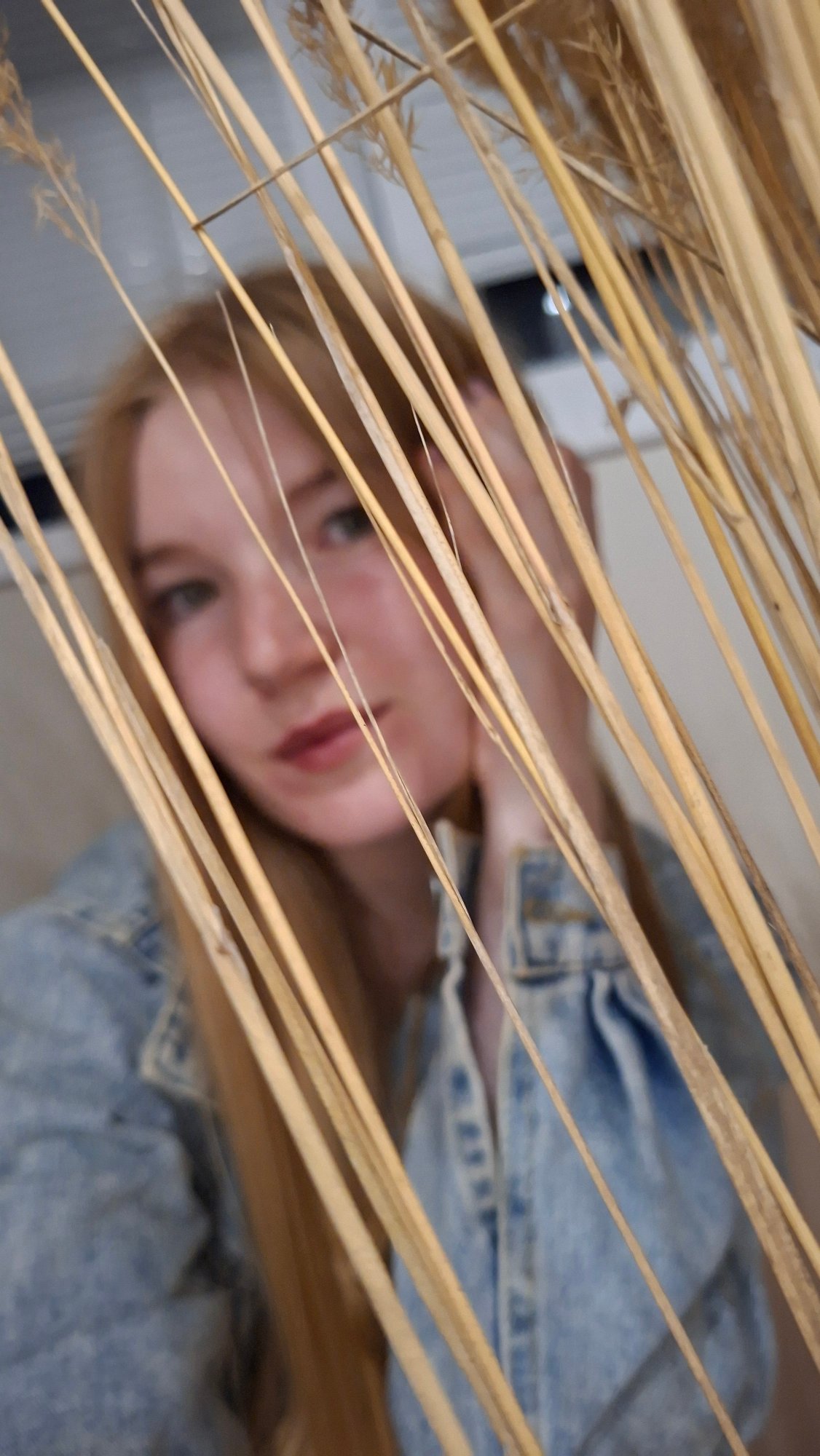 Woman stages creative photo session with flowers in Chaikovsky