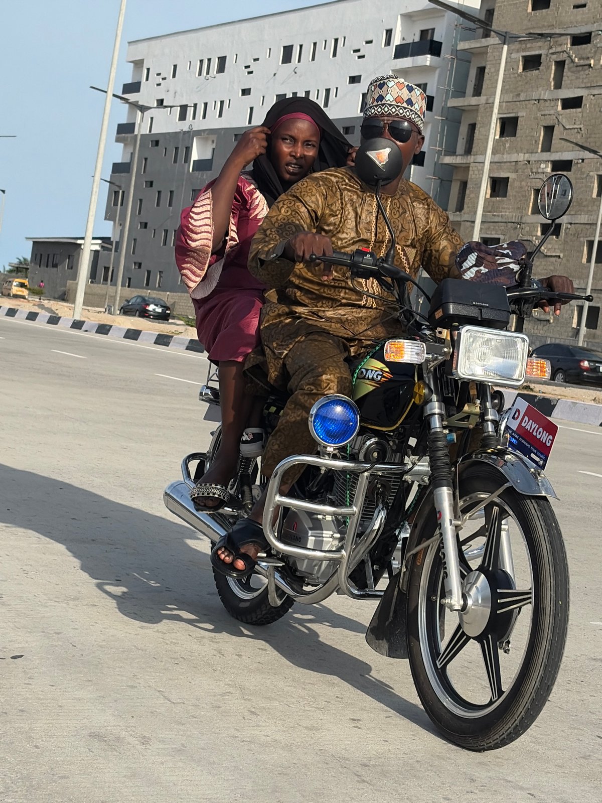 Daily life scenes captured in Alaguntan: motorcycle ride, cart pulling