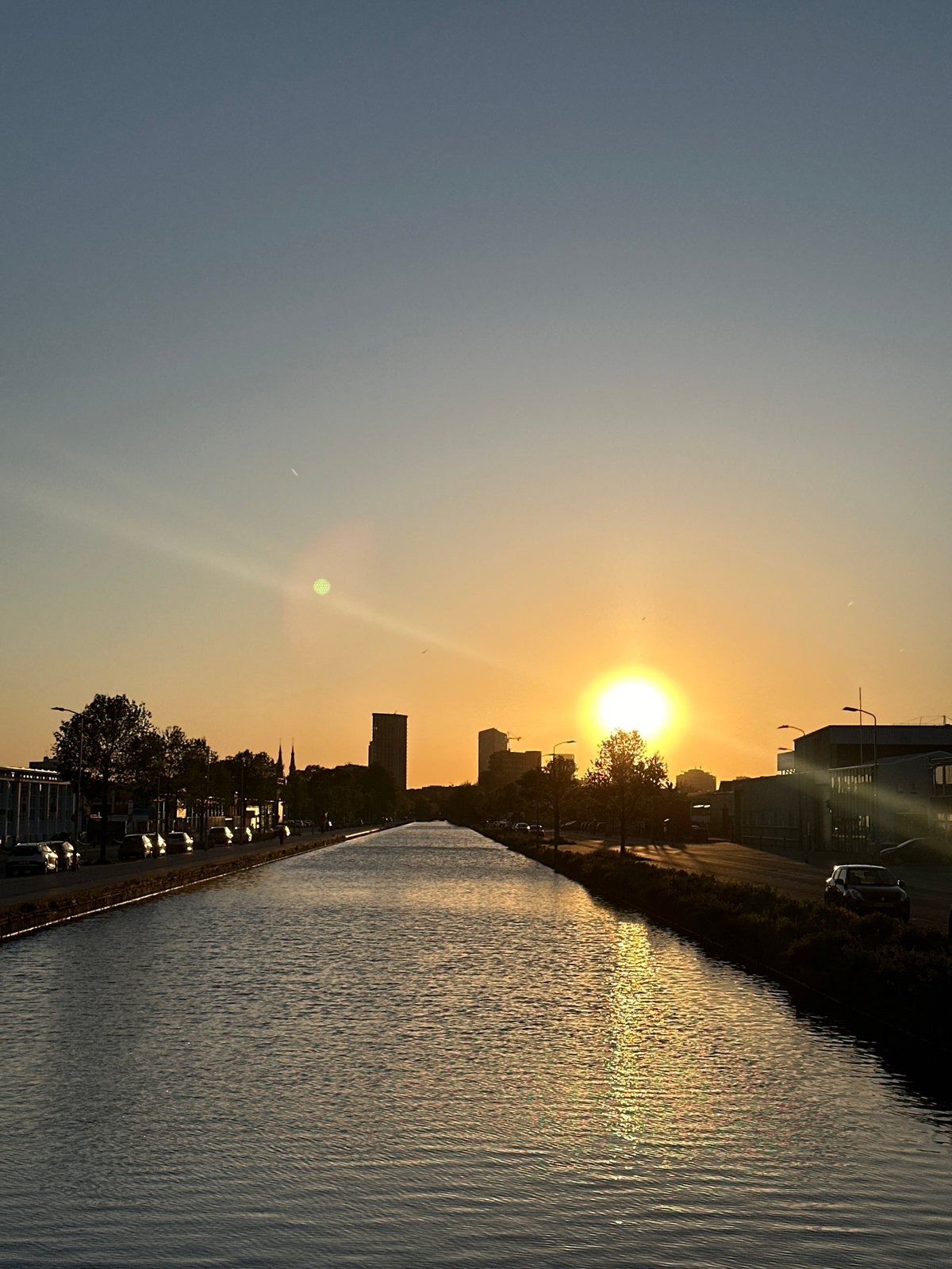 Peaceful sunset scene captured along Eindhoven waterway