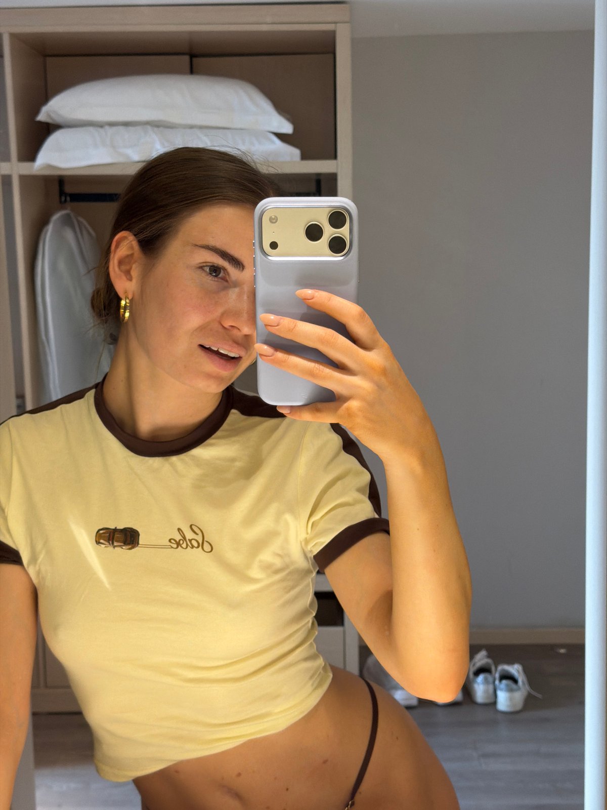 Woman takes mirror selfie in residential setting, Shunyi District