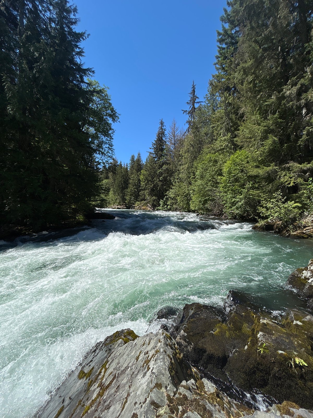 Relaxing afternoon by a turquoise river outside Whistler
