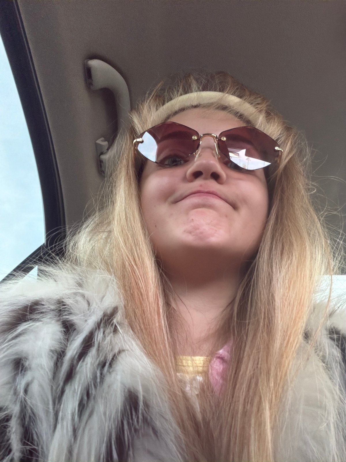 Young person photographed in car in Az'mushkino, Russia