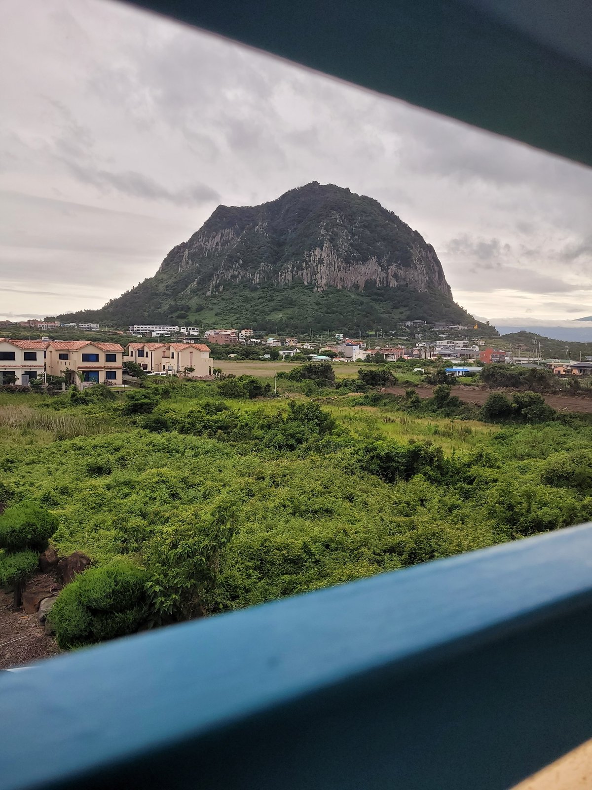 Overcast afternoon to twilight across Seogwipo-si, Jeju Island