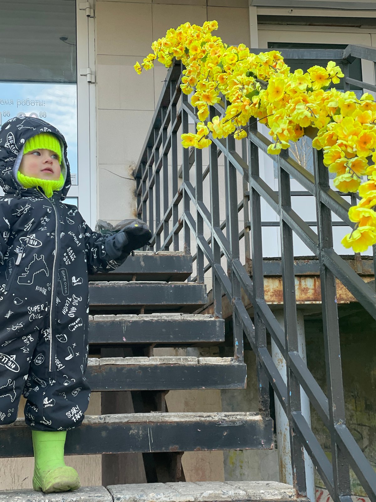 Adult and child take afternoon walk through central Izhevsk