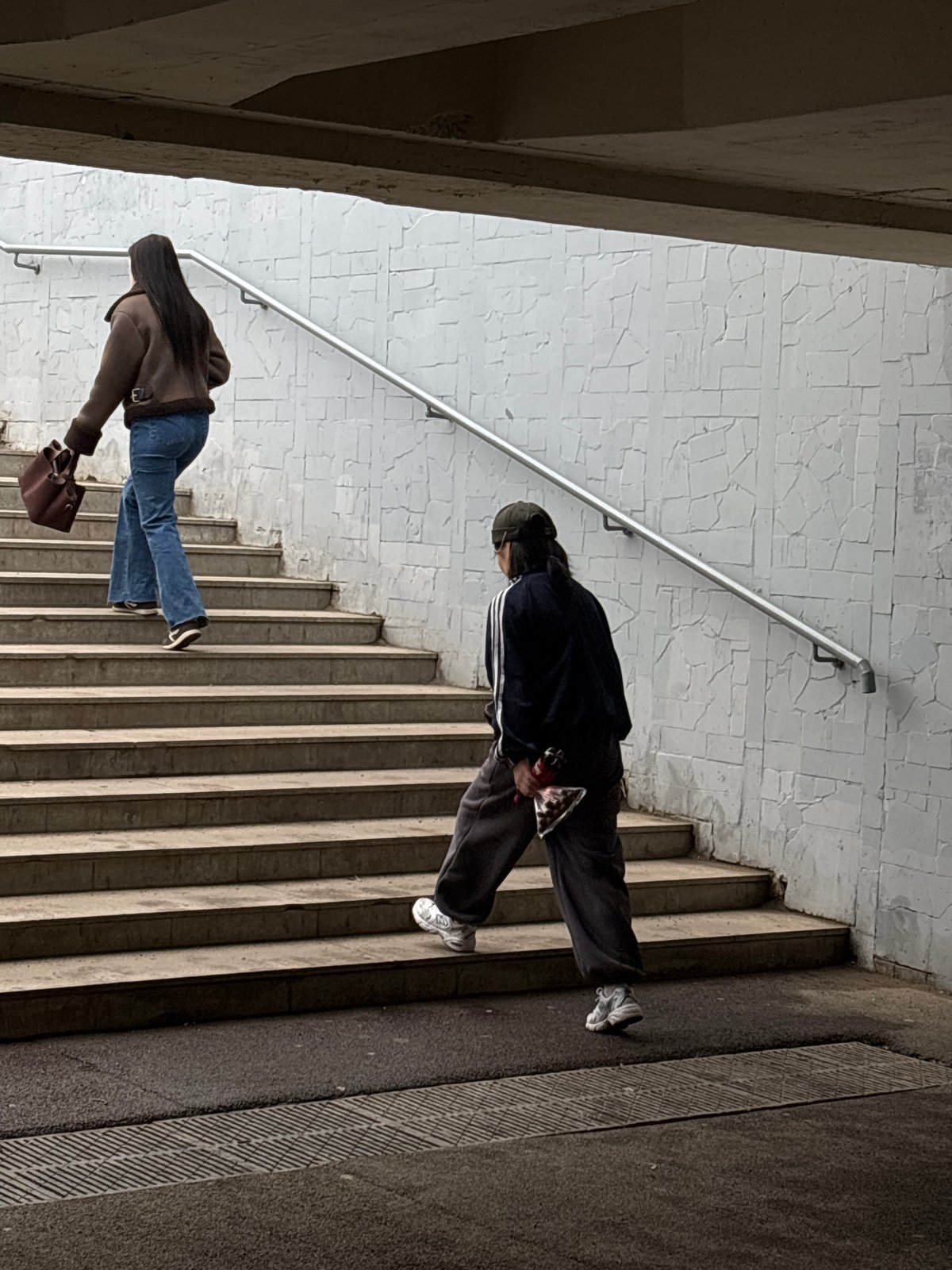 Pedestrians navigate underpass tunnel in Perm, Russia