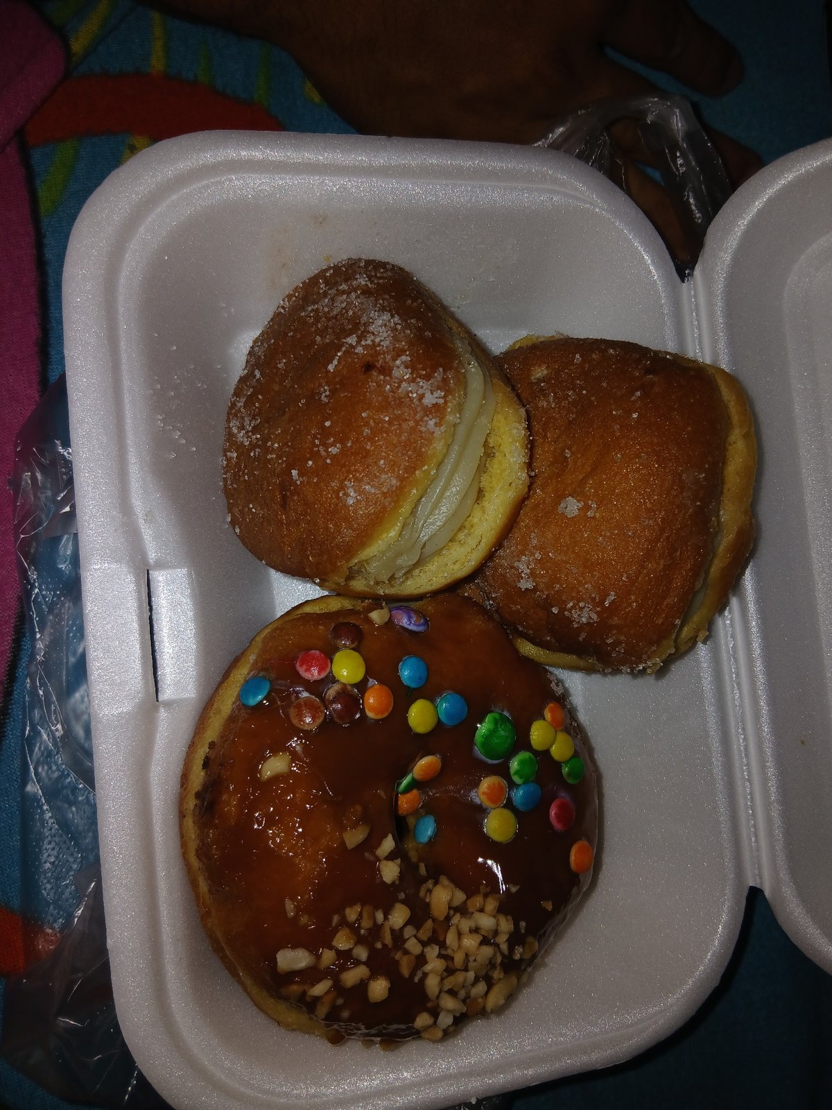 Person documents decorated donuts collection in Altagracia, Venezuela