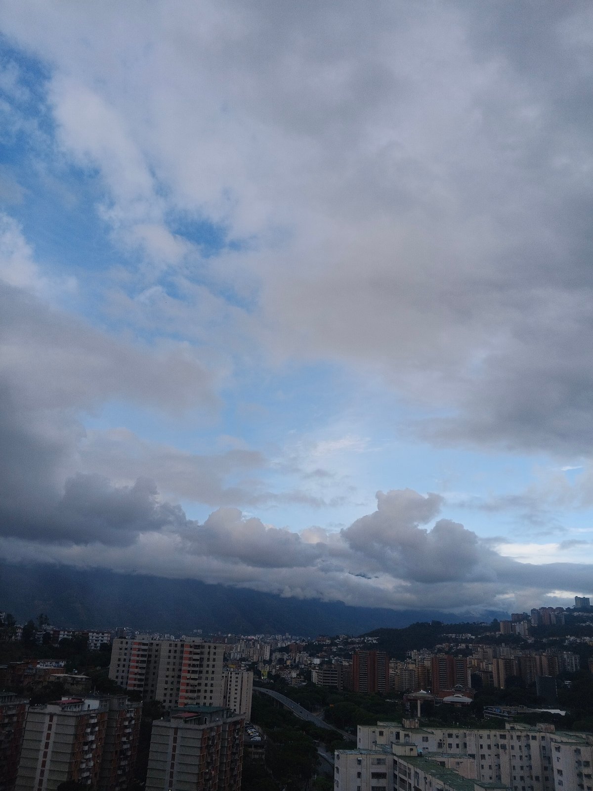 Caracas residents document cloudy evening cityscape views
